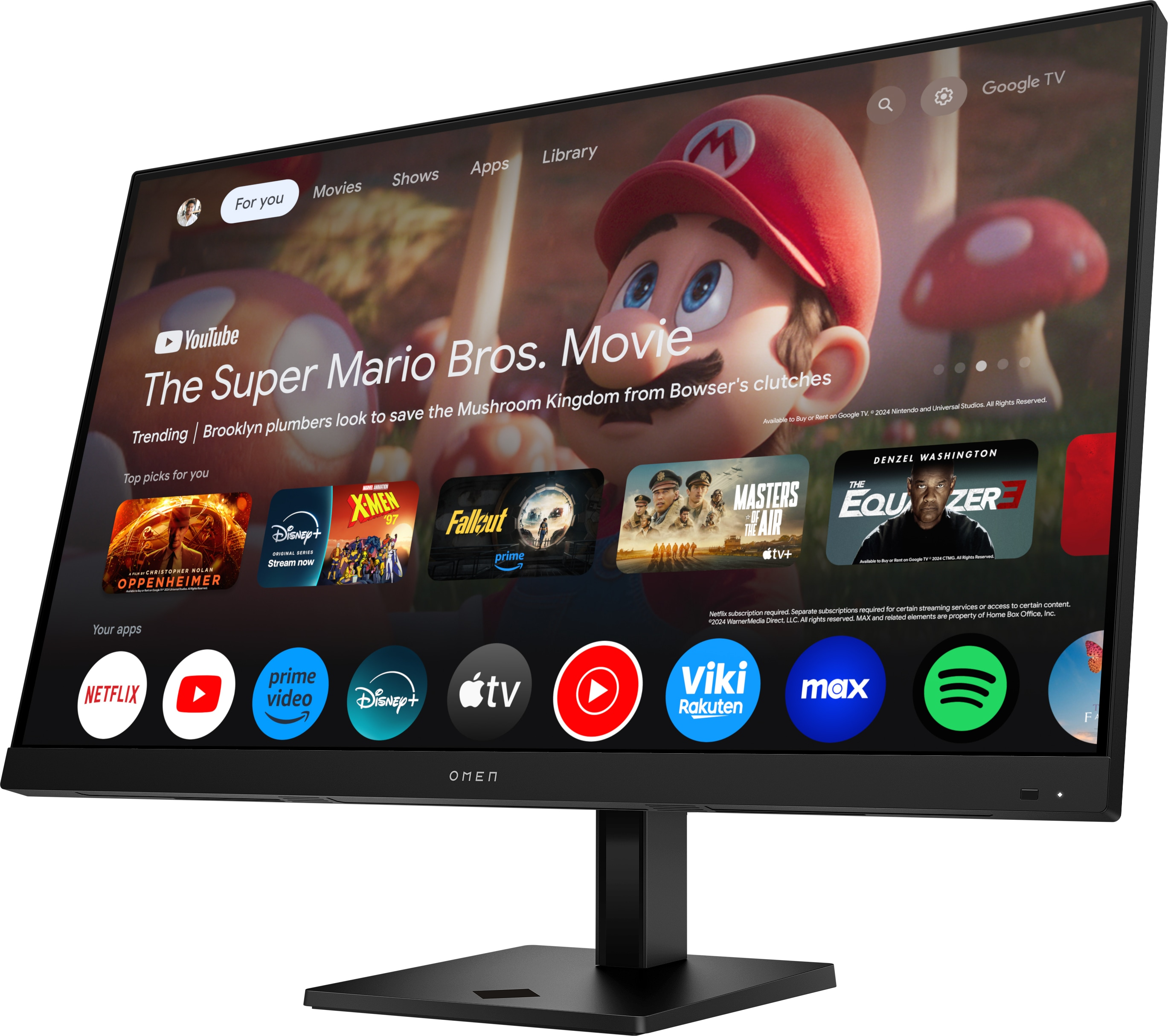 Ein Monitor zeigt die Google TV-Oberfläche mit dem Film "Super Mario Bros." und App-Symbolen.