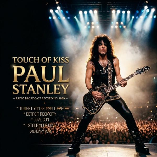 Paul Stanley spielt Gitarre auf einer Bühne vor einem Publikum, beleuchtet von Scheinwerfern.