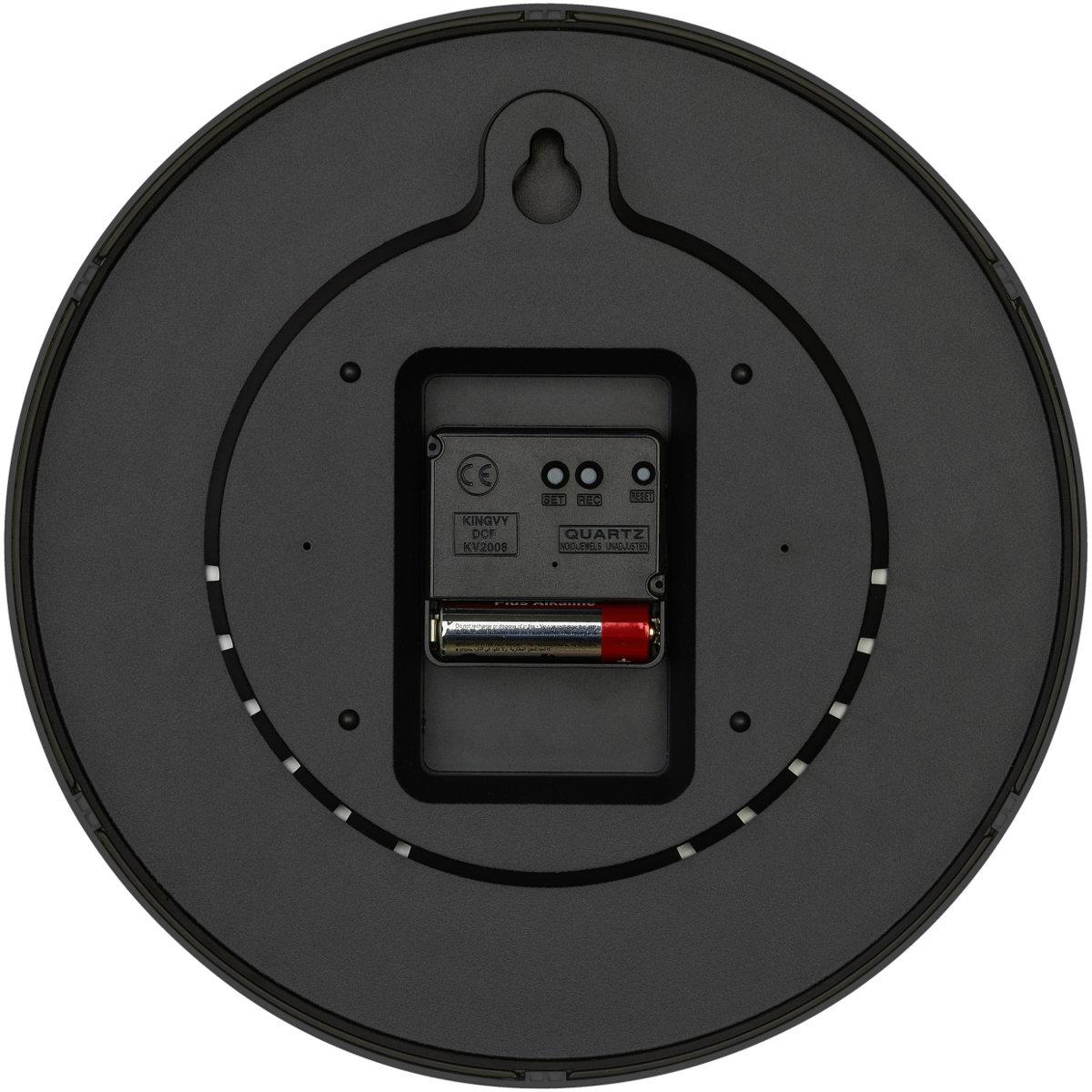 Rückseite einer schwarzen Wanduhr mit Quarzwerk, Batteriefach und Aufhängehaken.