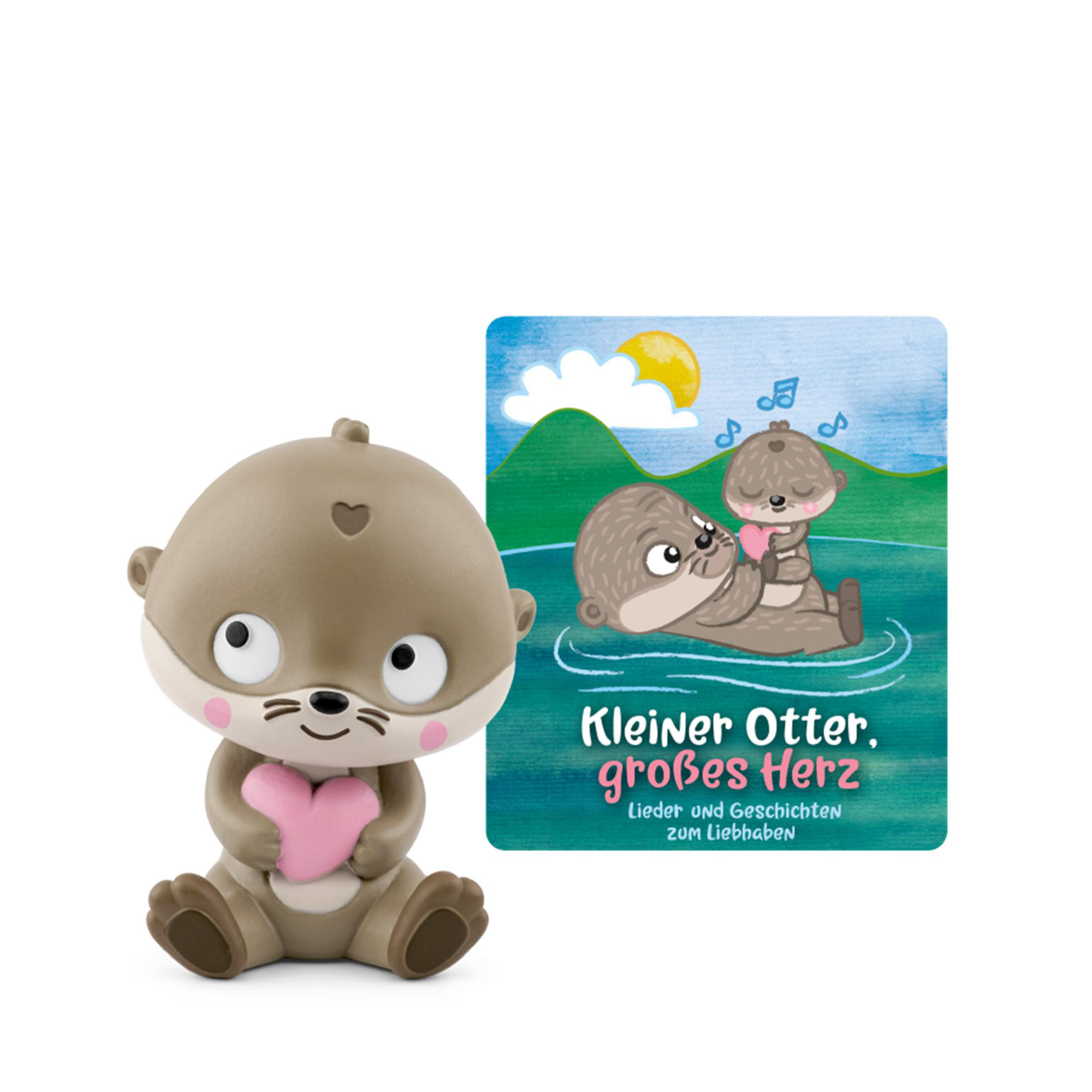 Ein Otter-Spielzeug hält ein rosa Herz. Daneben ein Buch mit Ottern im Wasser.