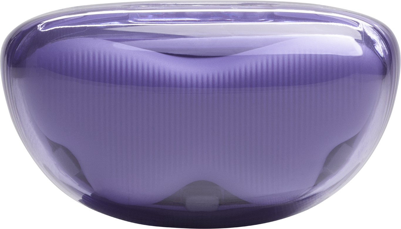 Lila iMac G3 számítógépház fekete háttérrel.