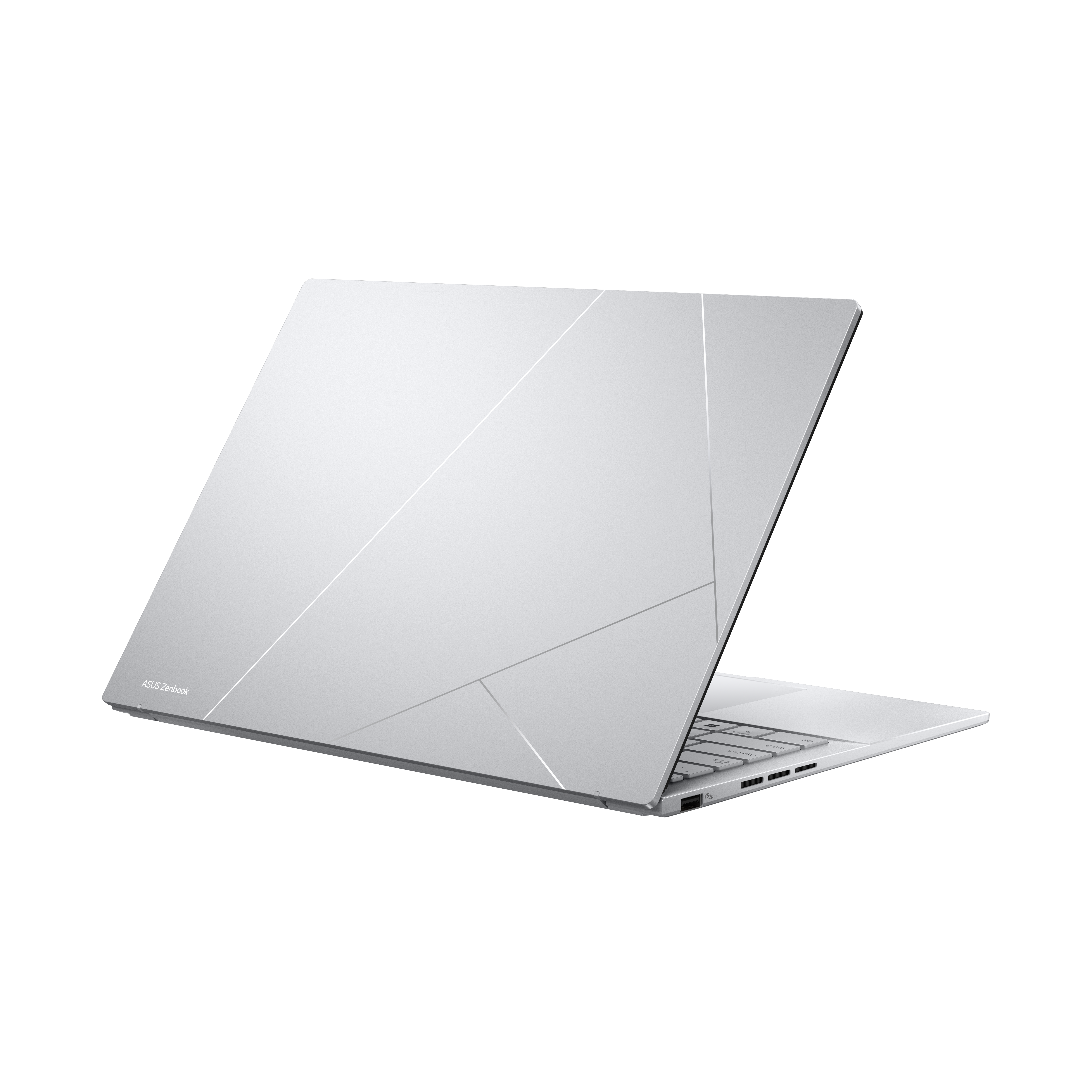 Ein silberner Laptop mit asymmetrischem Design und beleuchteter Tastatur.