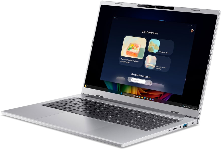 Egy ezüst laptop sötét képernyőt mutat AI-javaslatokkal.