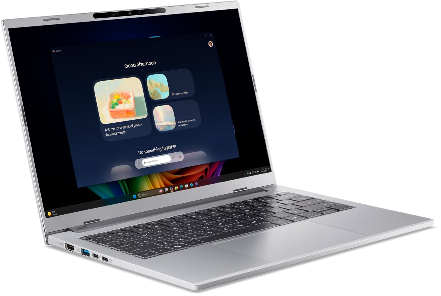 Ezüst laptop sötét képernyővel, amely egy MI felületet mutat.