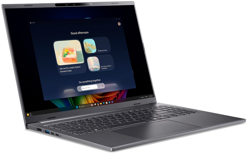 Egy szürke laptop sötét képernyőt mutat MI funkciókkal.