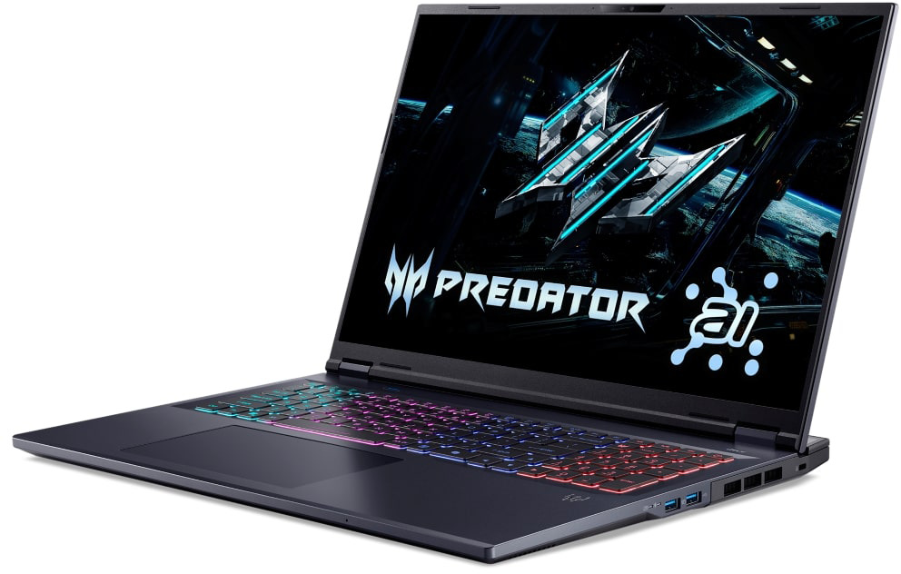 Sötét laptop világító billentyűzettel és Predator logóval a képernyőn.