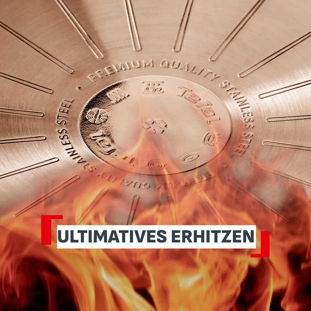 Boden einer Pfanne mit Prägungen und Flammen darunter.