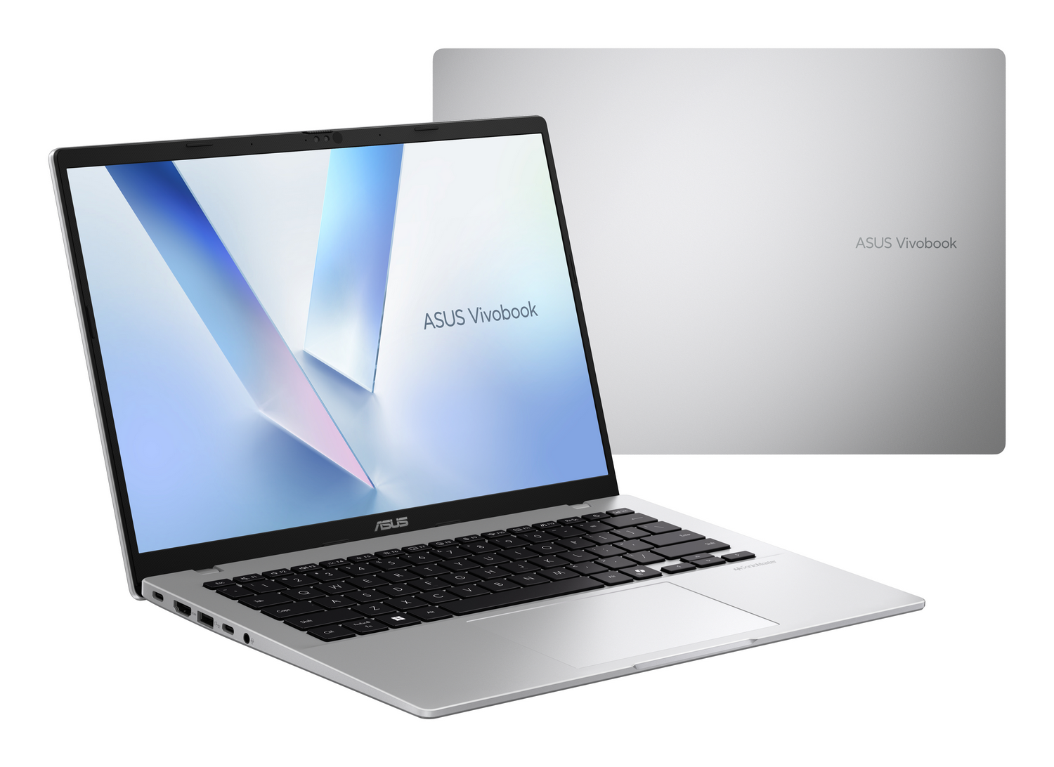 Un portátil ASUS Vivobook plateado, abierto y mostrado de lado. Detrás hay un portátil cerrado.