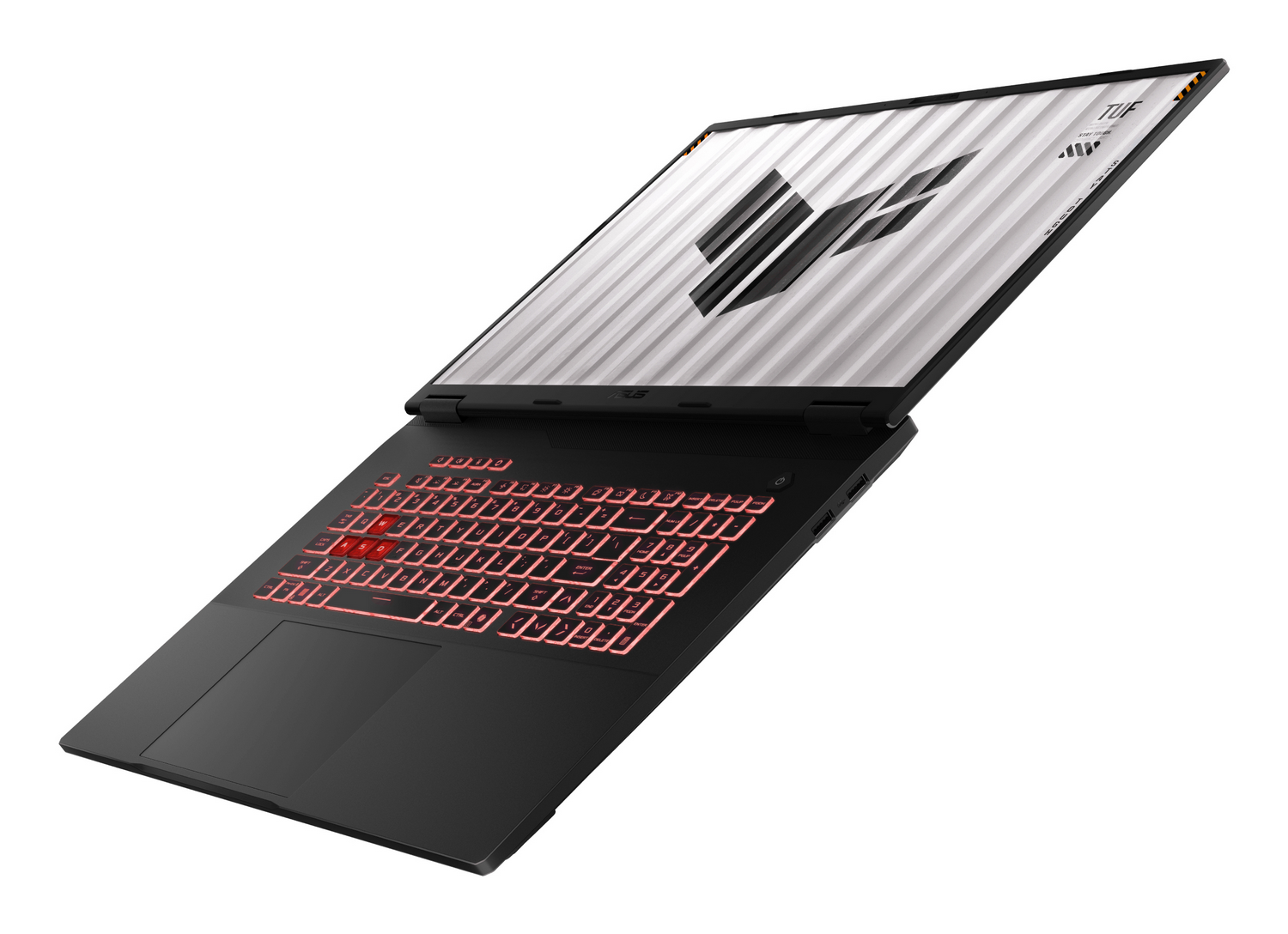 Portátil negro con iluminación roja en el teclado y logo TUF en pantalla.