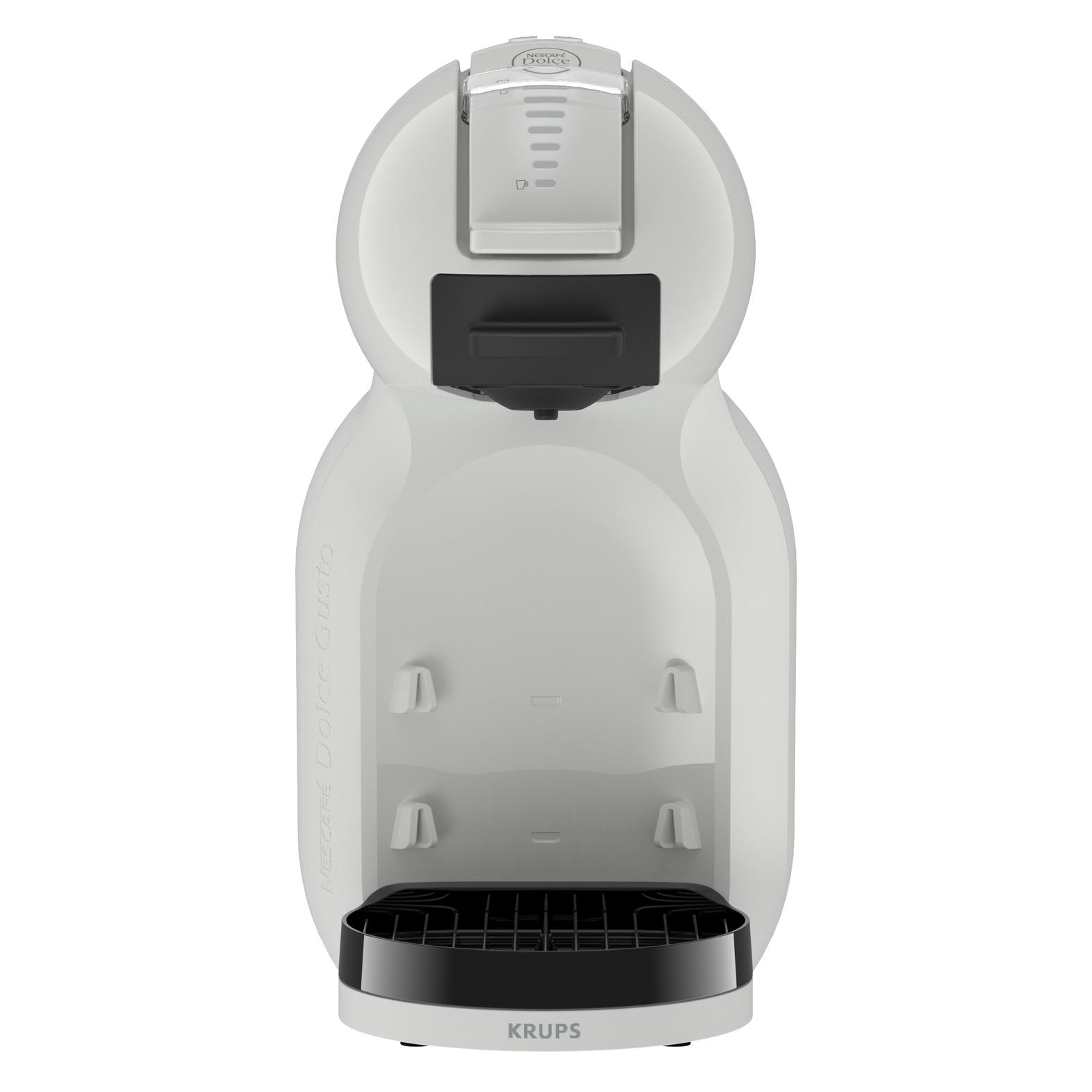 Eine weiße Kaffeemaschine mit schwarzem Abtropfblech und NESCAFÉ Dolce Gusto Logo.