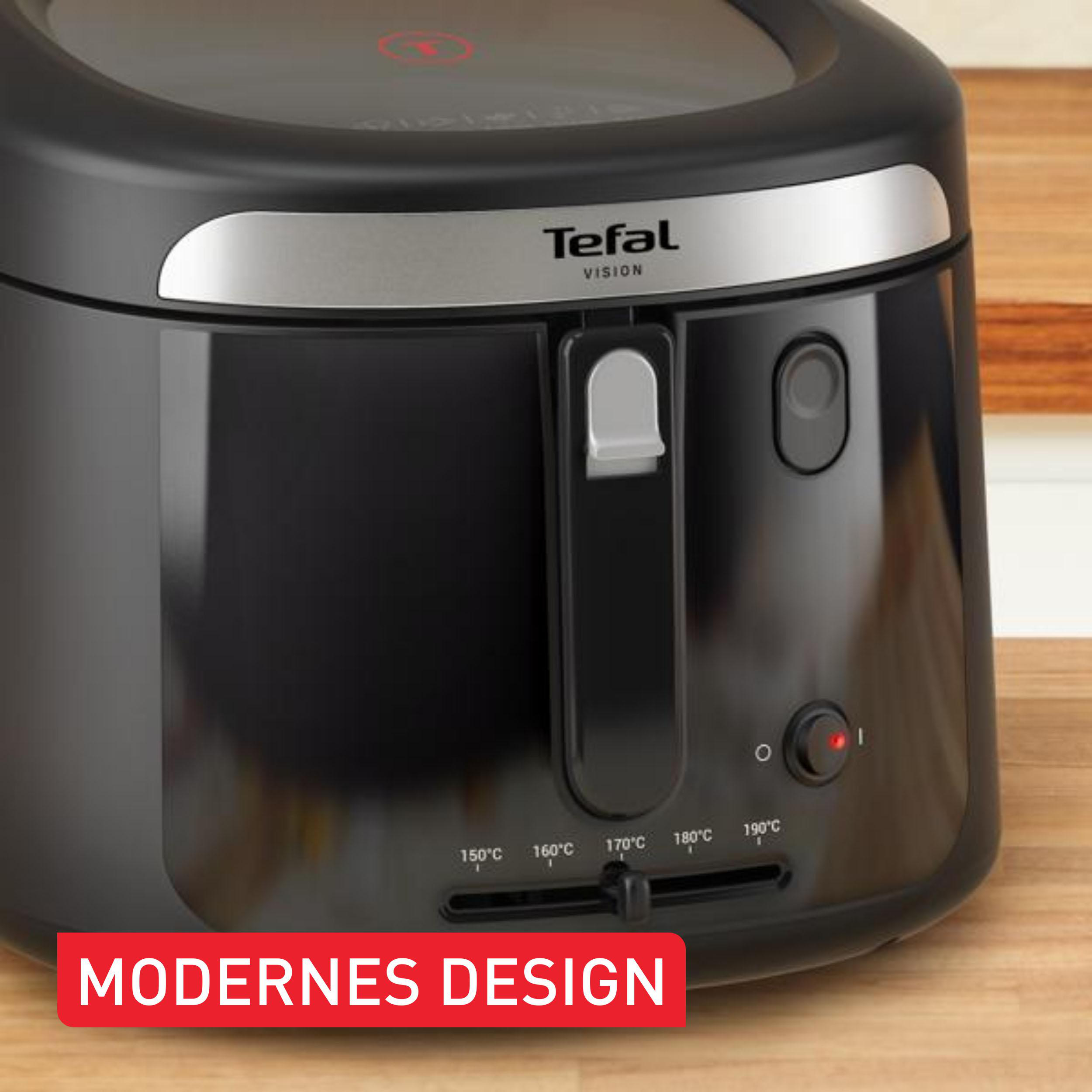 Schwarzer Tefal Vision Heißluftfritteuse mit Temperaturregler auf Holztisch.