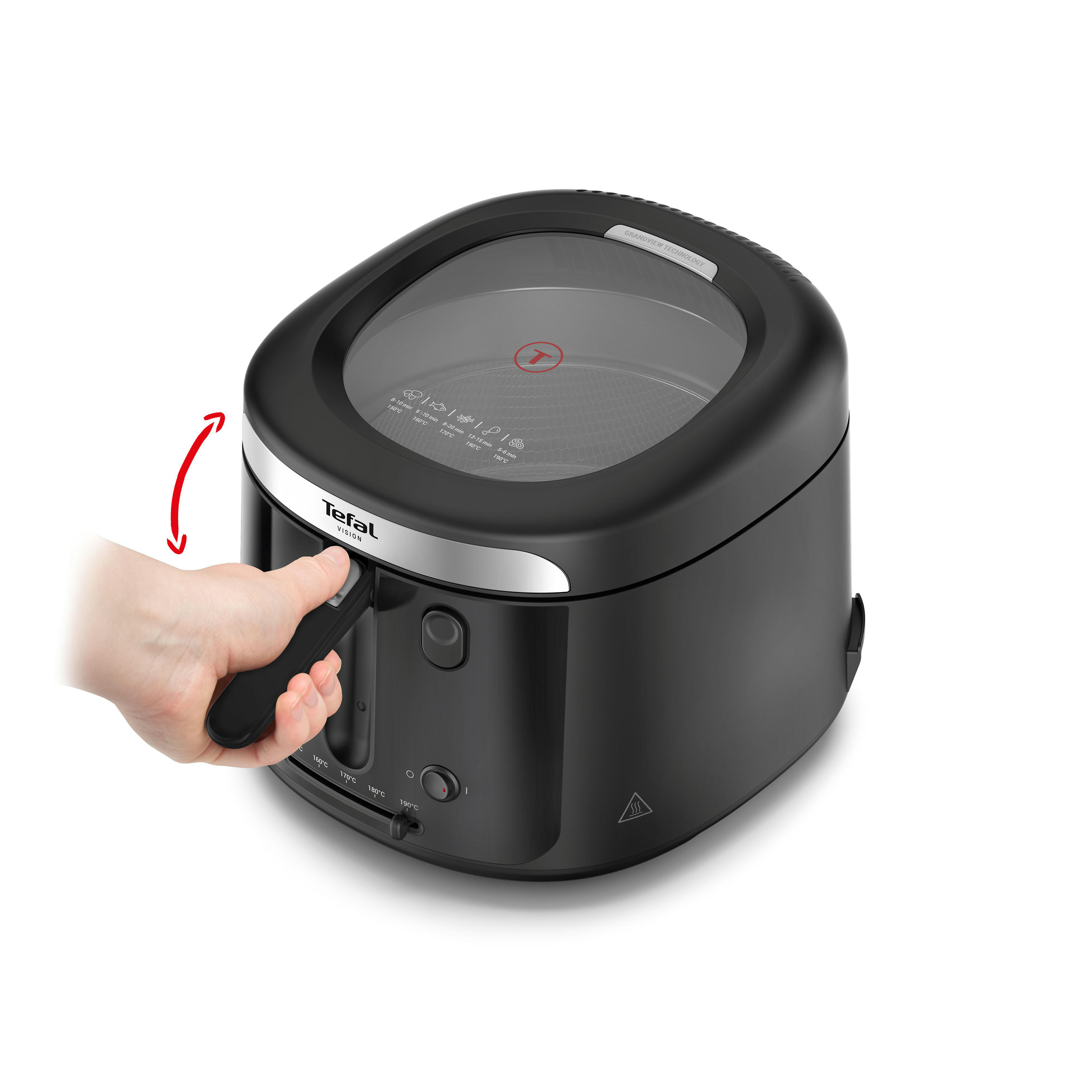 Eine schwarze Tefal Vision Heißluftfritteuse mit Glasdeckel. Eine Hand bedient den Steuerhebel.