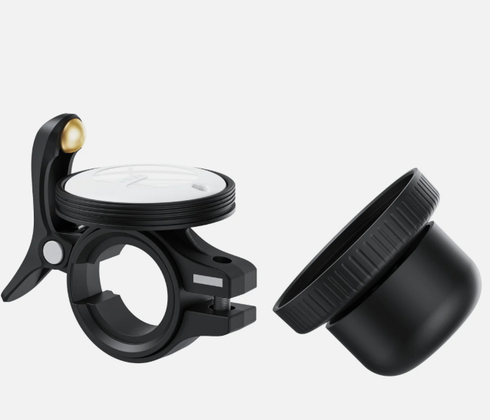 Ein schwarzer Fahrradhalter mit weißem Einsatz und ein separater schwarzer Aufsatz.