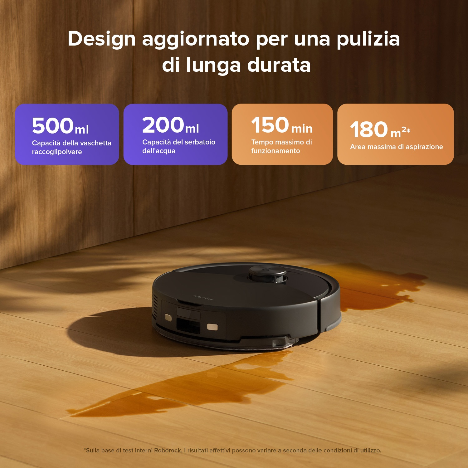 Un robot aspirapolvere nero pulisce un pavimento in legno con del liquido versato.