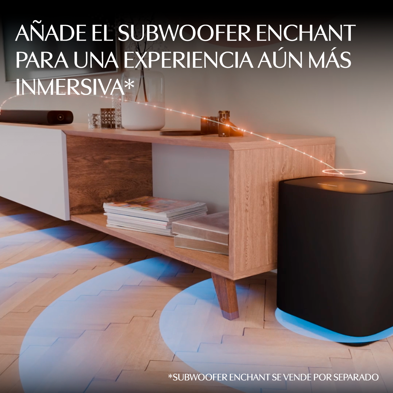 Un subwoofer negro con luz azul junto a un mueble de madera con barra de sonido.