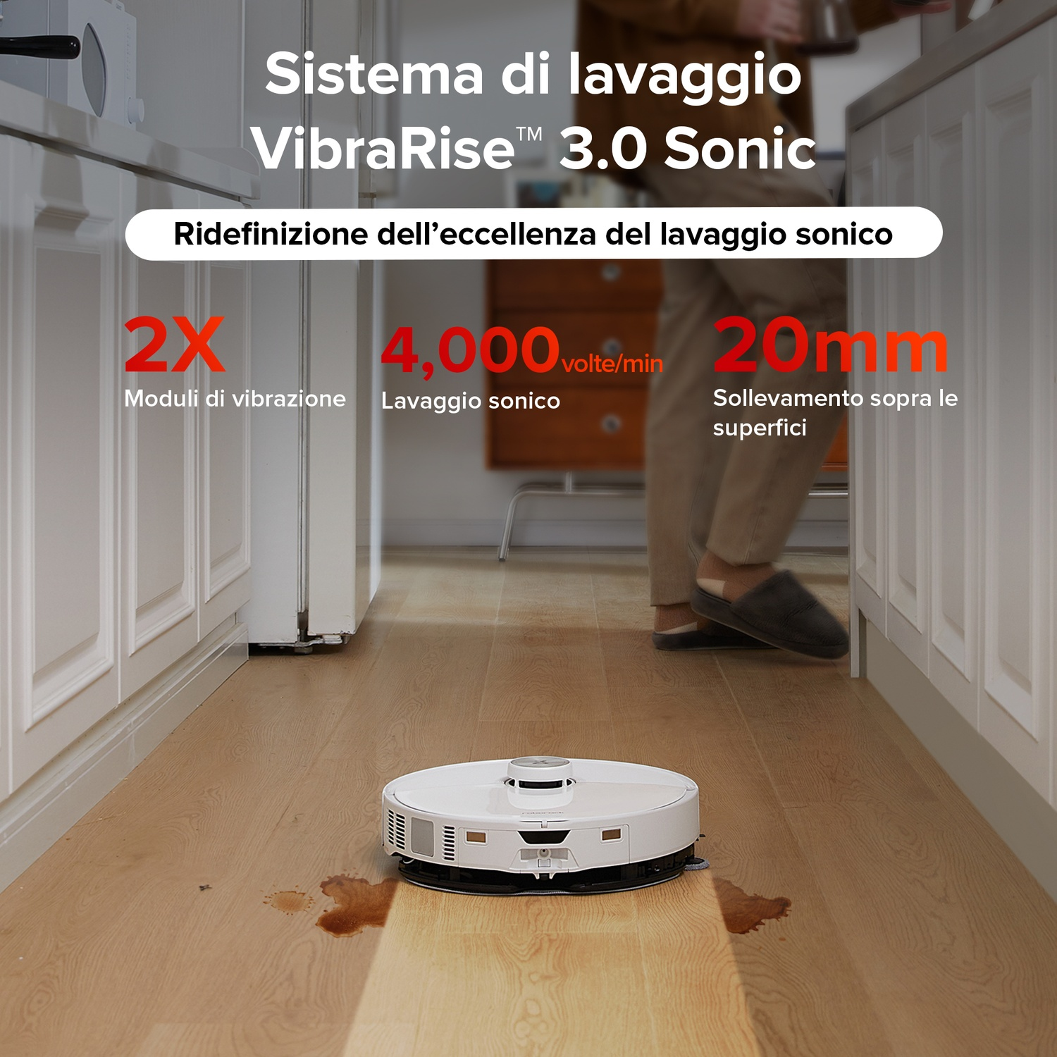 Un robot aspirapolvere bianco su un pavimento in legno con una macchia di liquido.