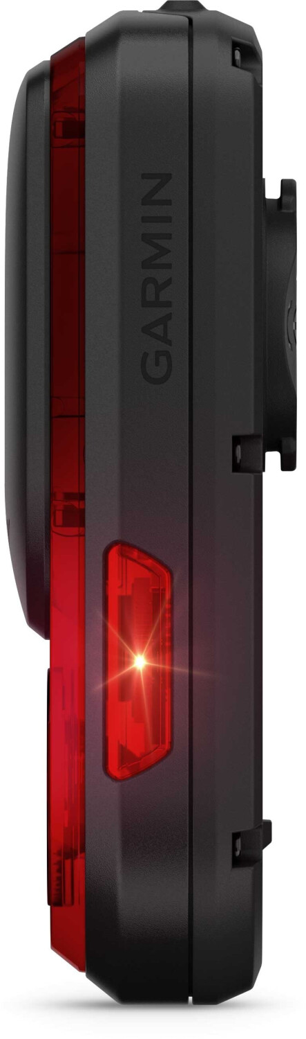 Czarny Garmin z czerwonym światłem tylnym i flarą obiektywu.