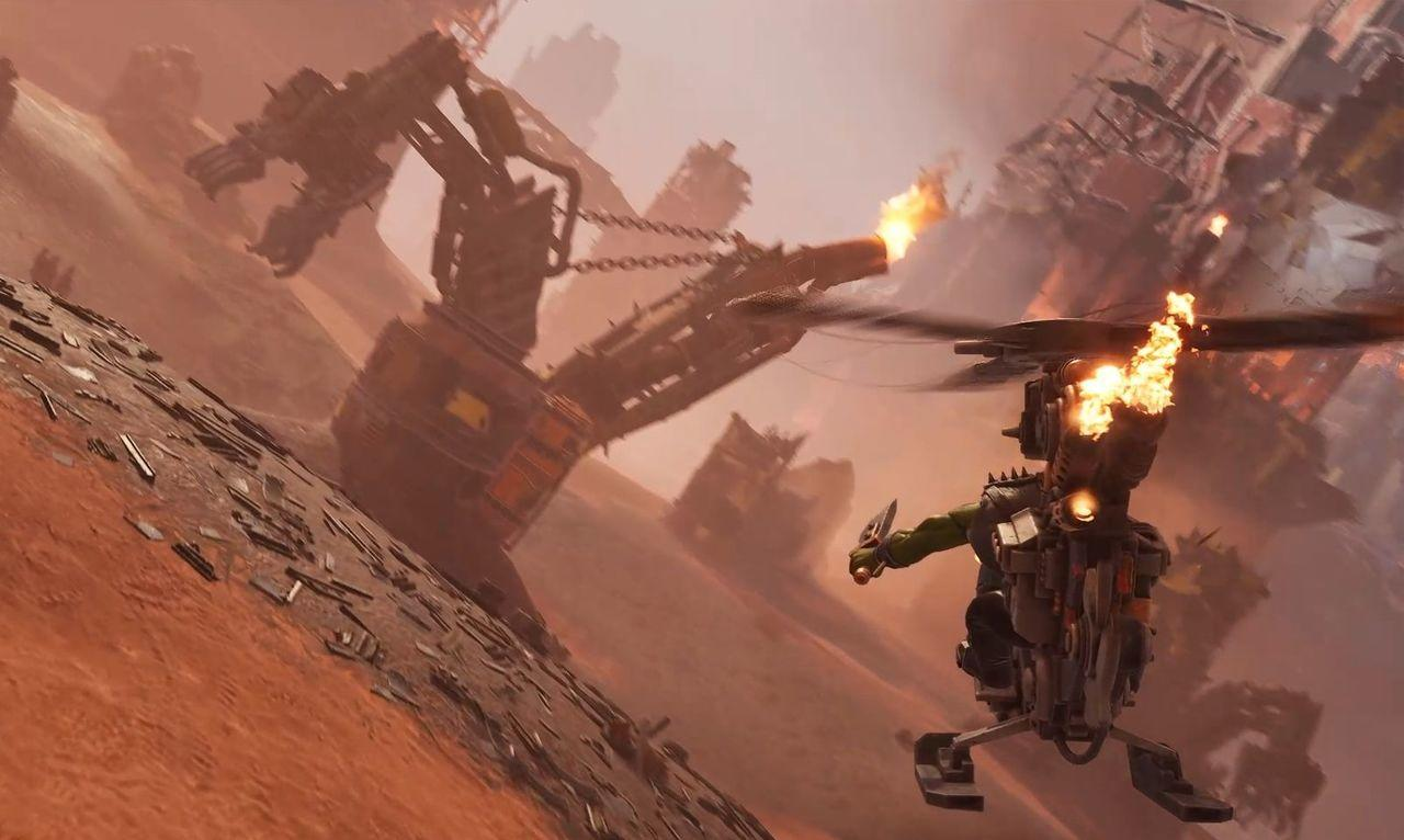 Ein Ork in einem fliegenden Fahrzeug feuert eine Waffe ab, während im Hintergrund Ruinen zu sehen sind.