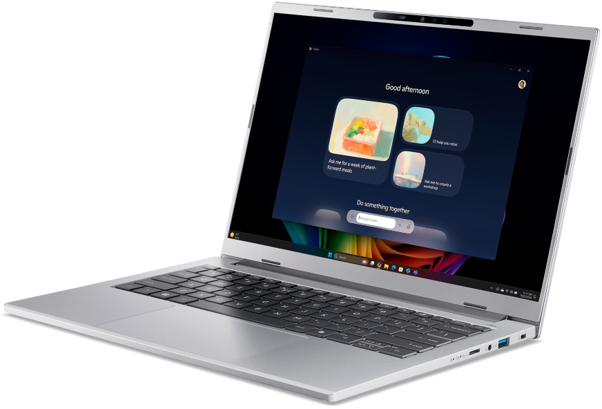 Ezüst laptop sötét képernyővel, személyre szabott felülettel.