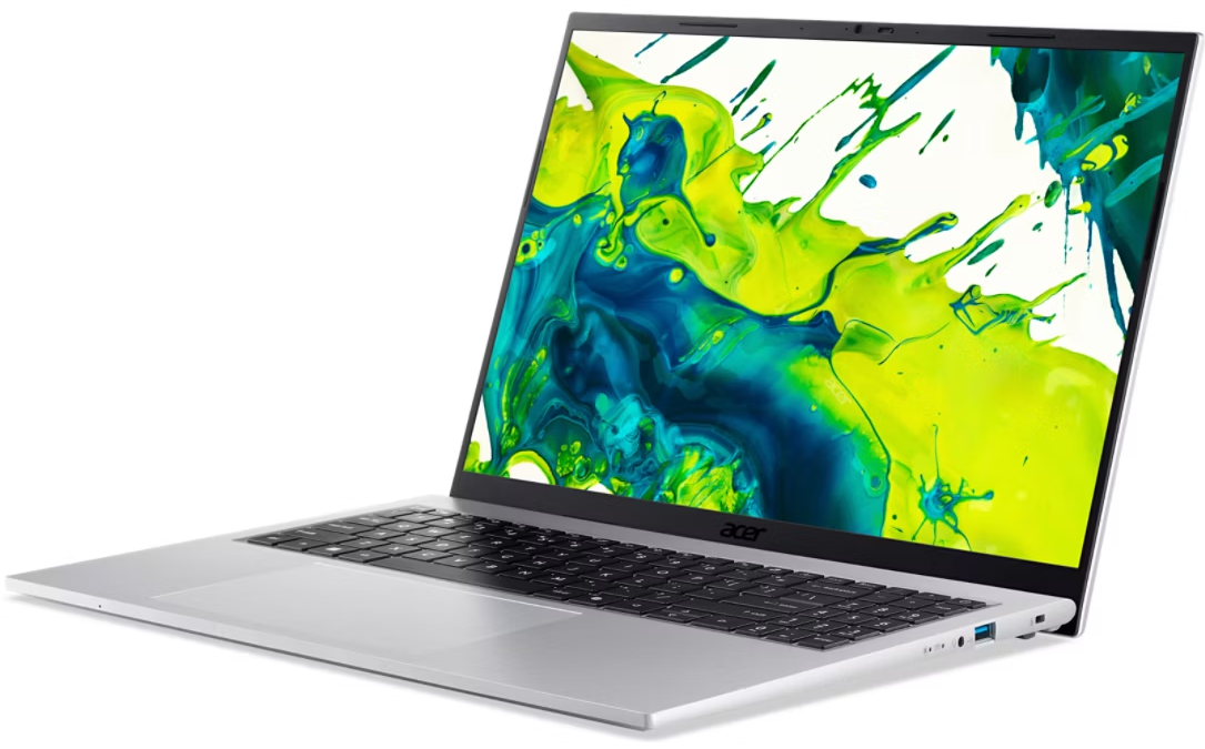 Ezüst laptop színes fröccsentett háttérképpel a képernyőn.