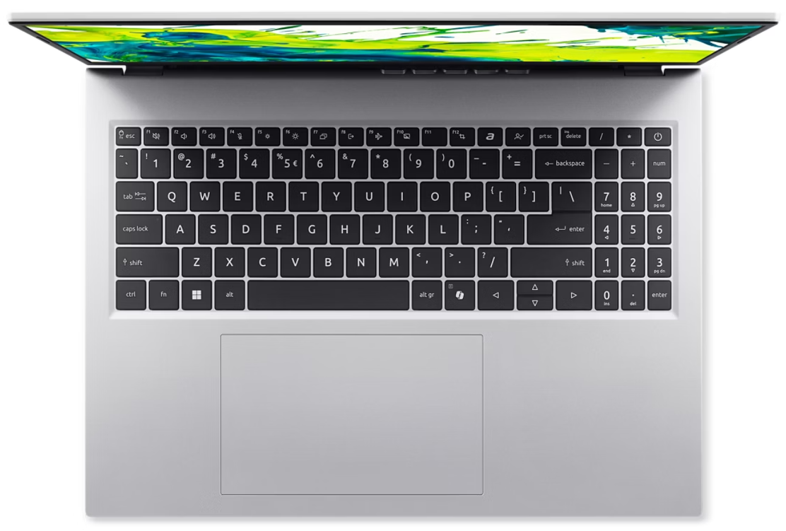 Ezüst laptop felülnézetből, billentyűzet és színes háttérgrafikás képernyő látható.