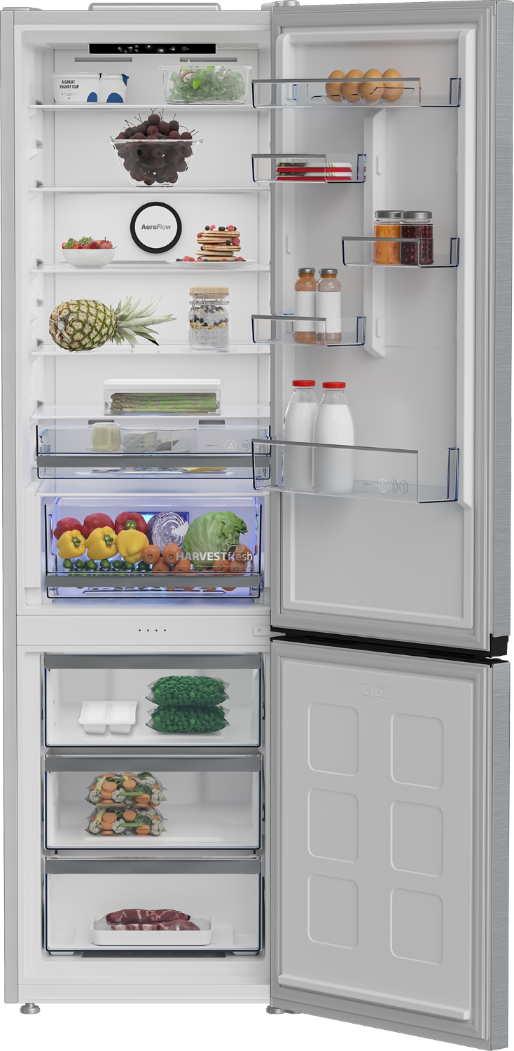 Un refrigerador abierto lleno de alimentos como frutas, verduras, huevos, leche, mermeladas y carne.