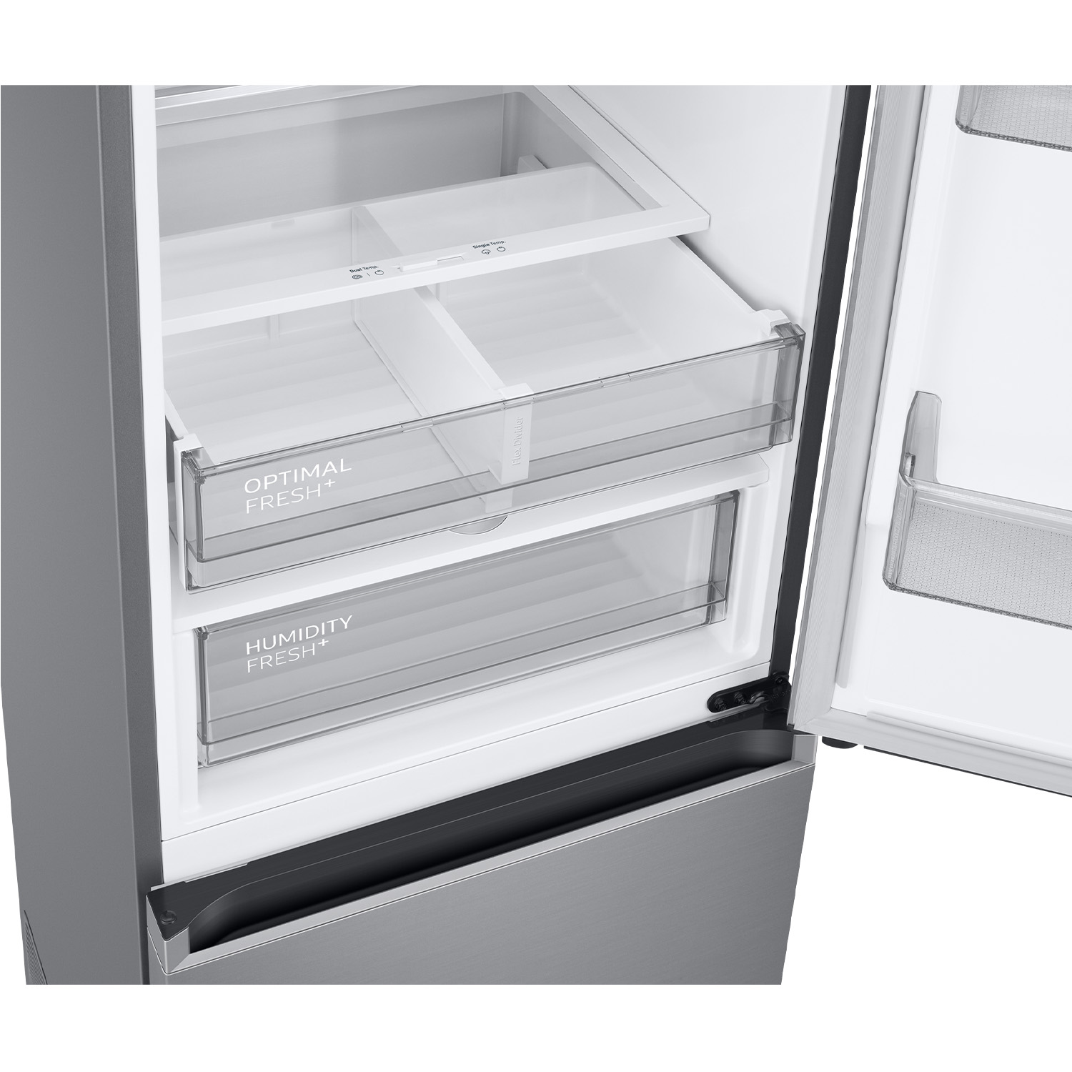 Interior de un refrigerador con cajones y estantes. Cuerpo de metal gris.