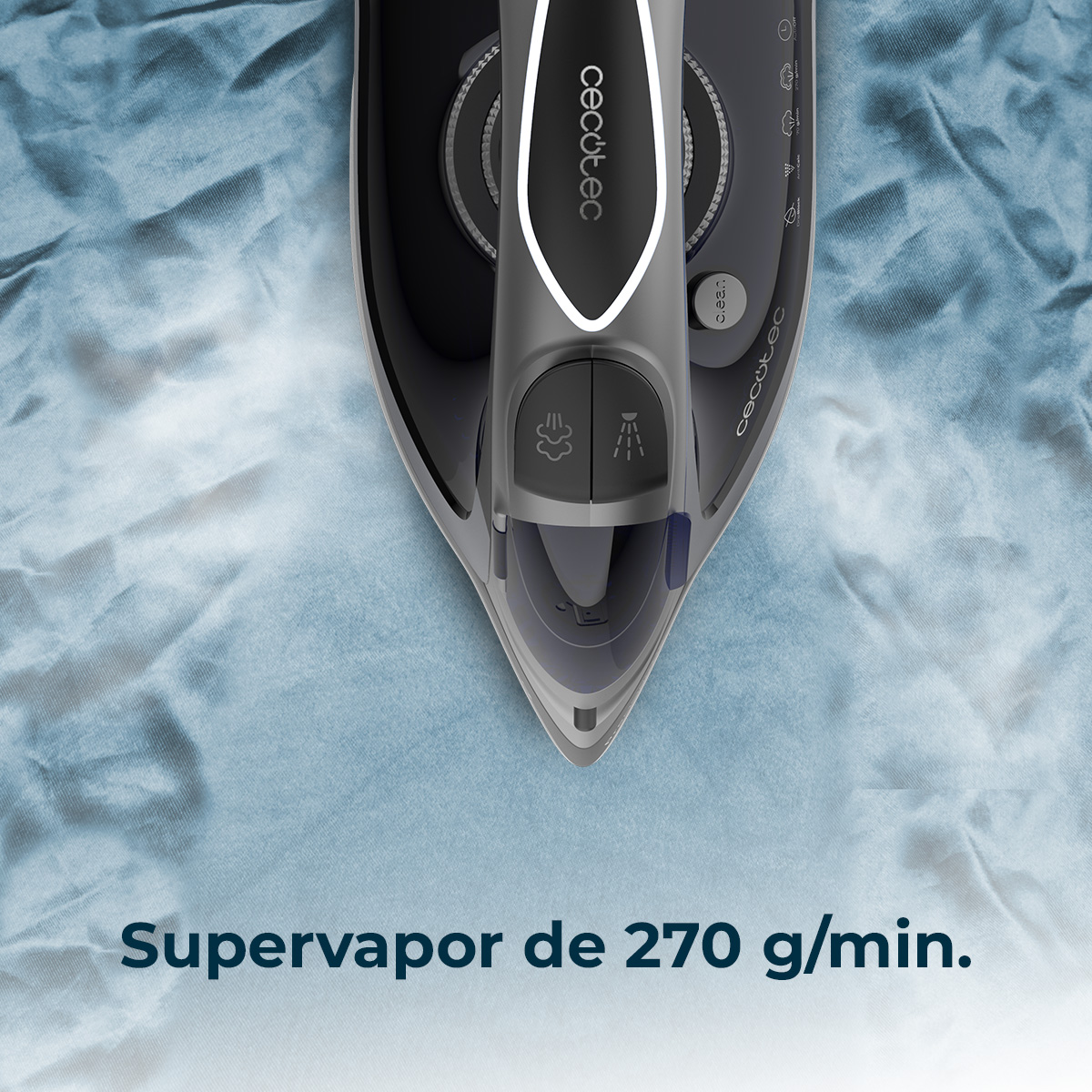 Una plancha sobre tela azul, con vapor.