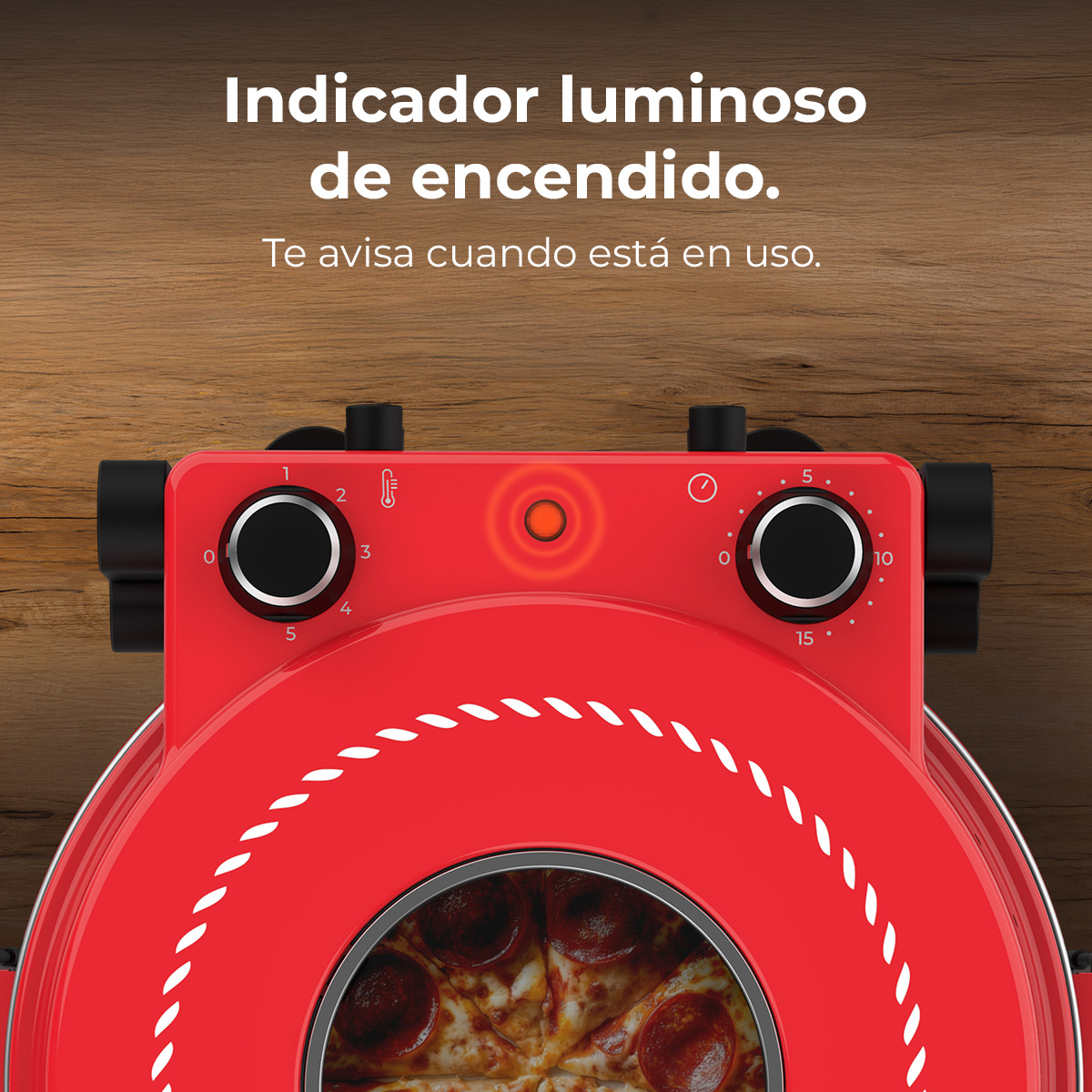 Horno de pizza rojo con indicador iluminado, diales y pizza dentro.