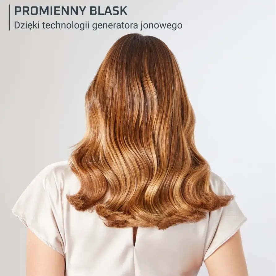 Widok z tyłu kobiety z długimi, falowanymi, jasnobrązowymi i blond włosami.