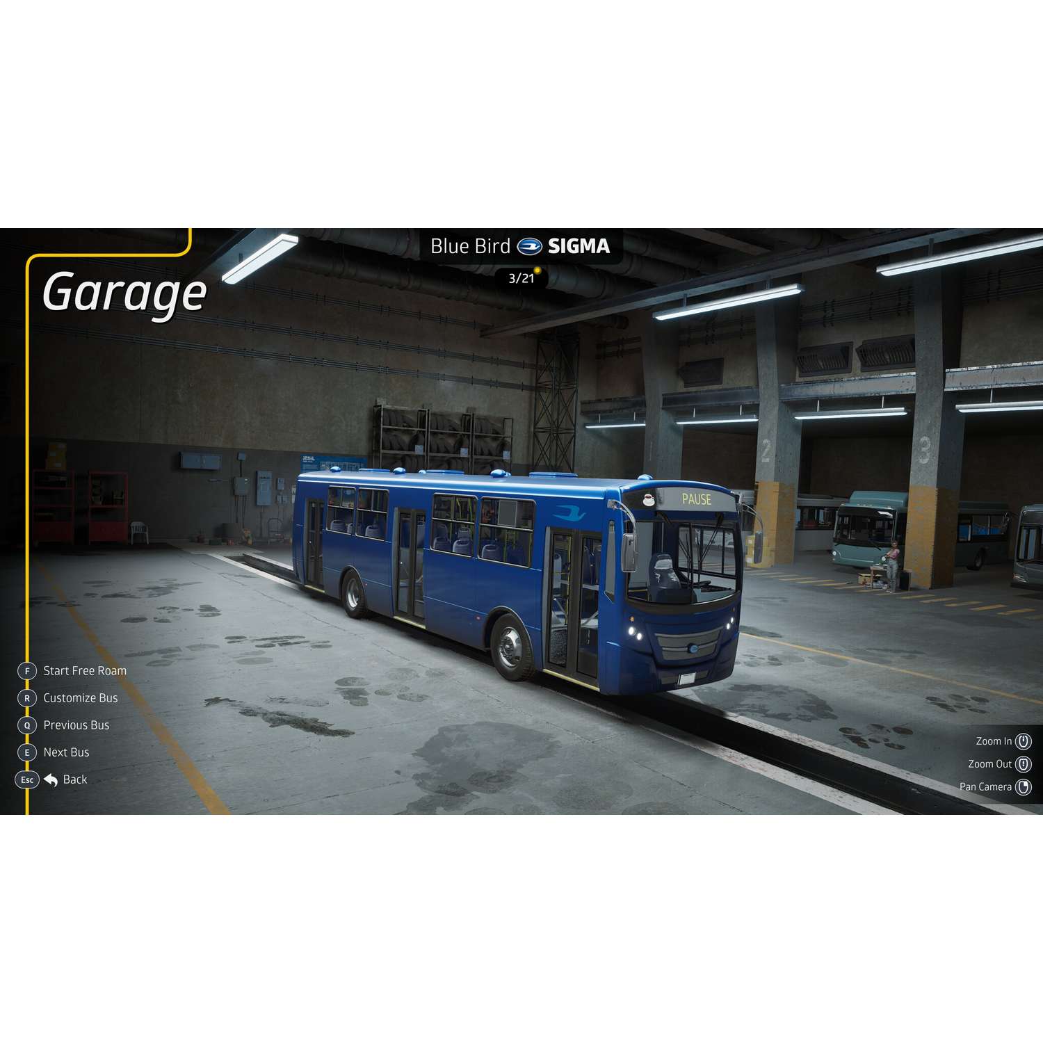 A blue bus garage with a blue bus in the foreground.