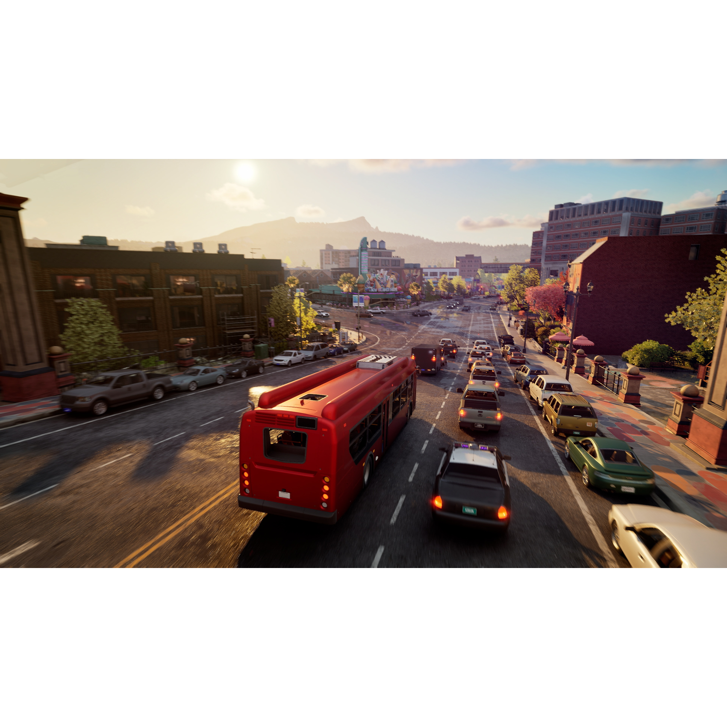 A red city bus drives on a busy street with many cars in traffic.