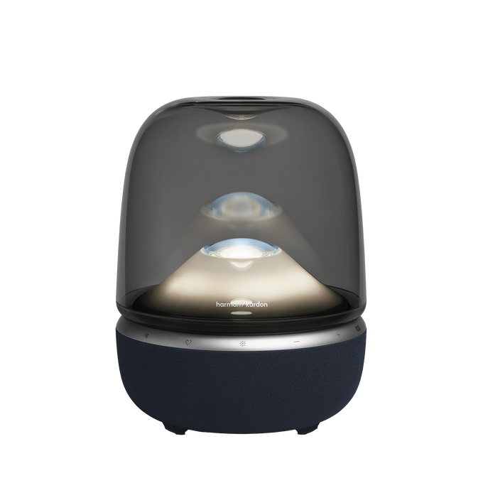 Un altavoz ovalado y translúcido con base de tela azul y luces internas.