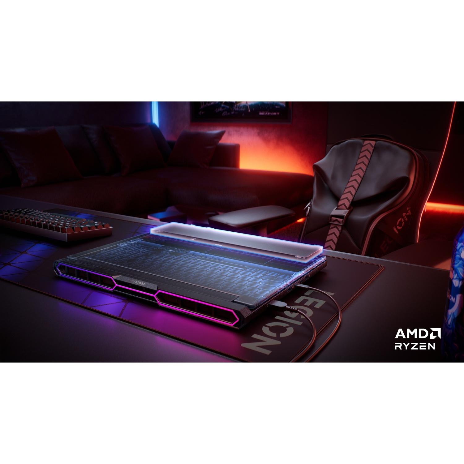 Un laptop da gaming con illuminazione RGB su una scrivania, con tastiera e sedia nelle vicinanze.