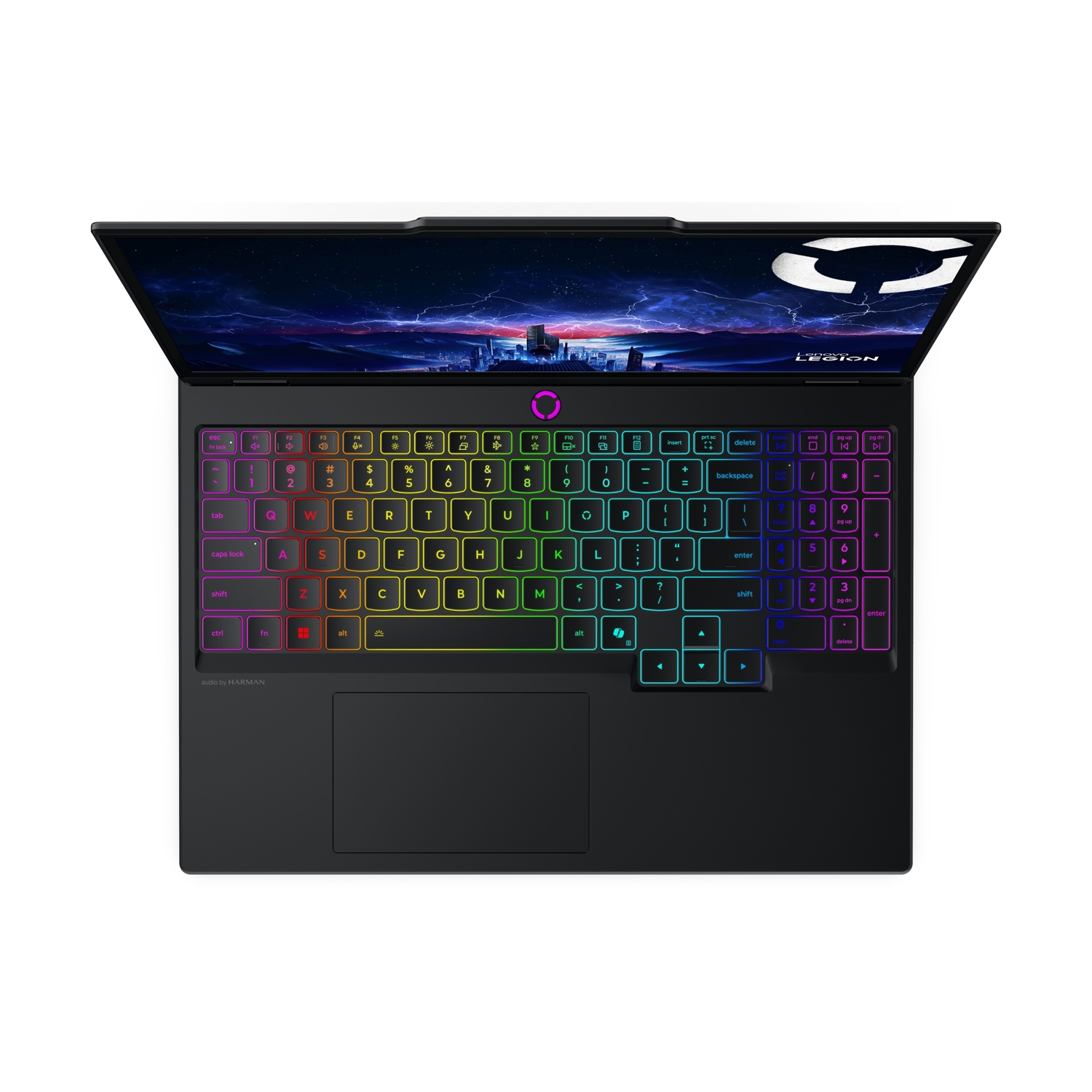 Un laptop nero aperto con tastiera colorata e sfondo di paesaggio urbano.
