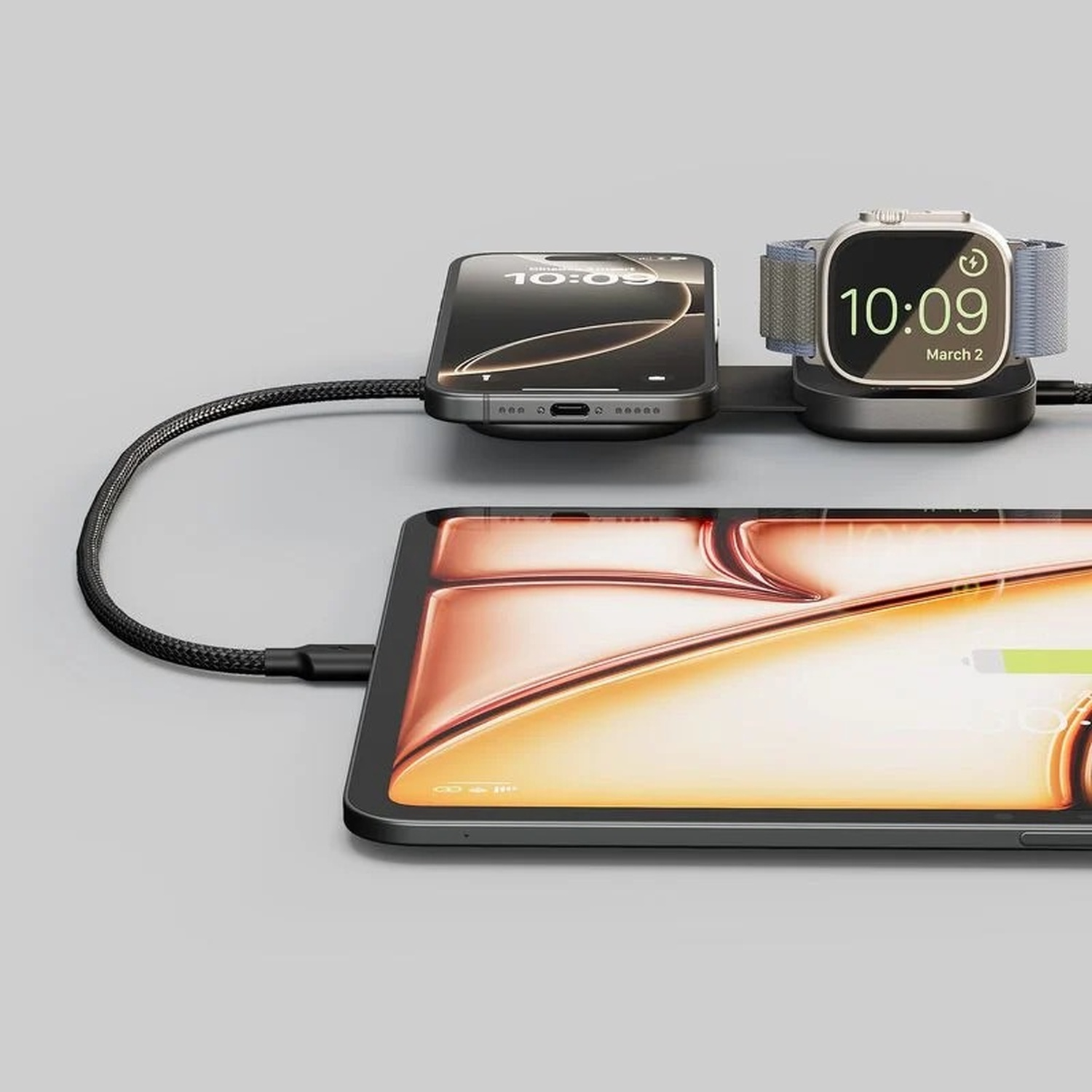 Una base di ricarica con iPhone, Apple Watch e tablet.