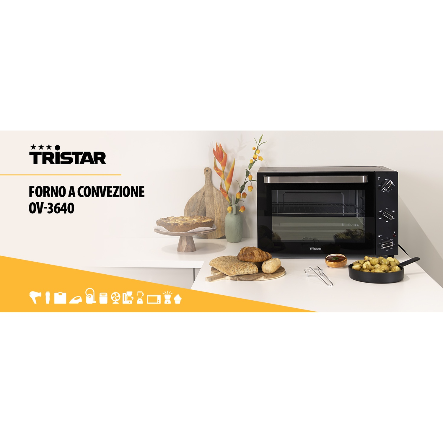 Forno Tristar nero con pane e patate, e una torta nelle vicinanze.
