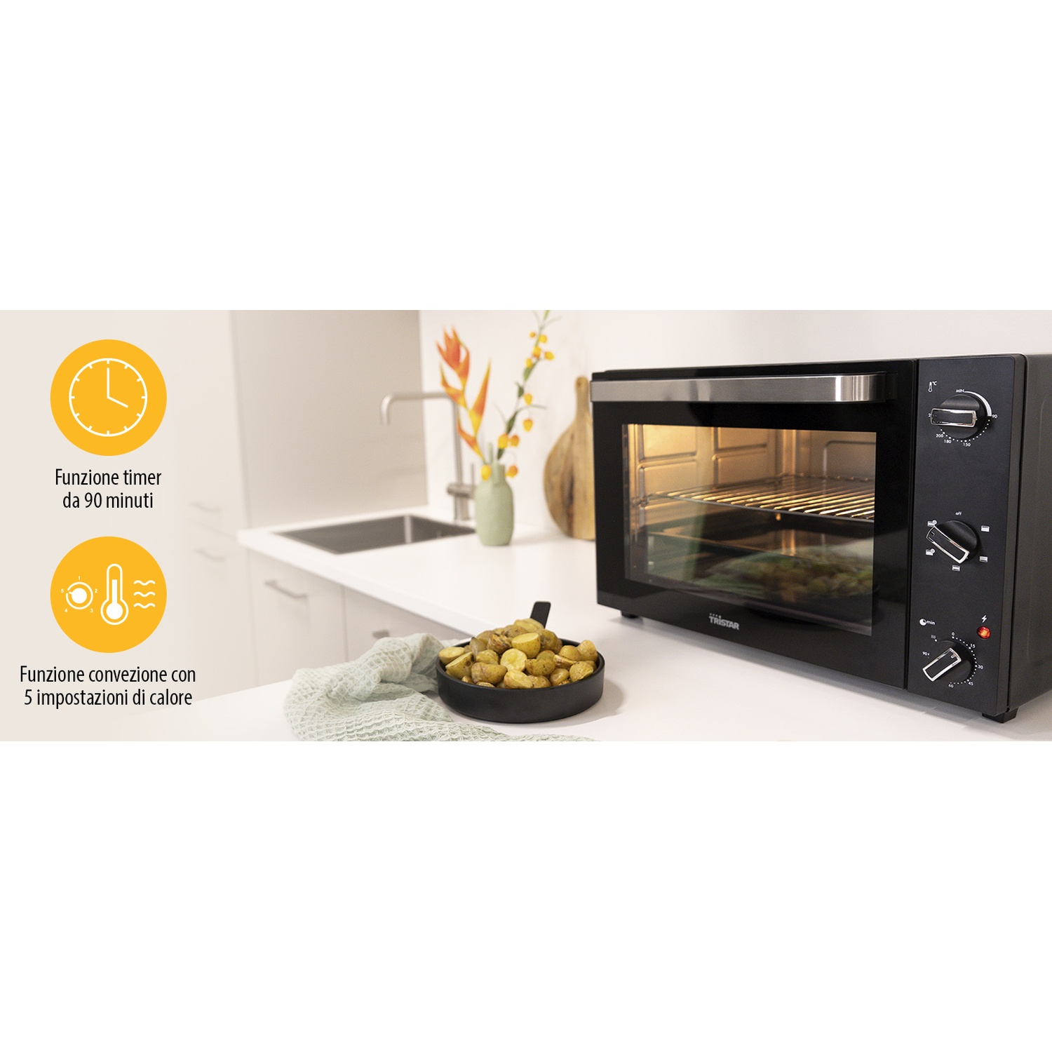 Forno nero con timer e controlli temperatura. Teglia di patate.