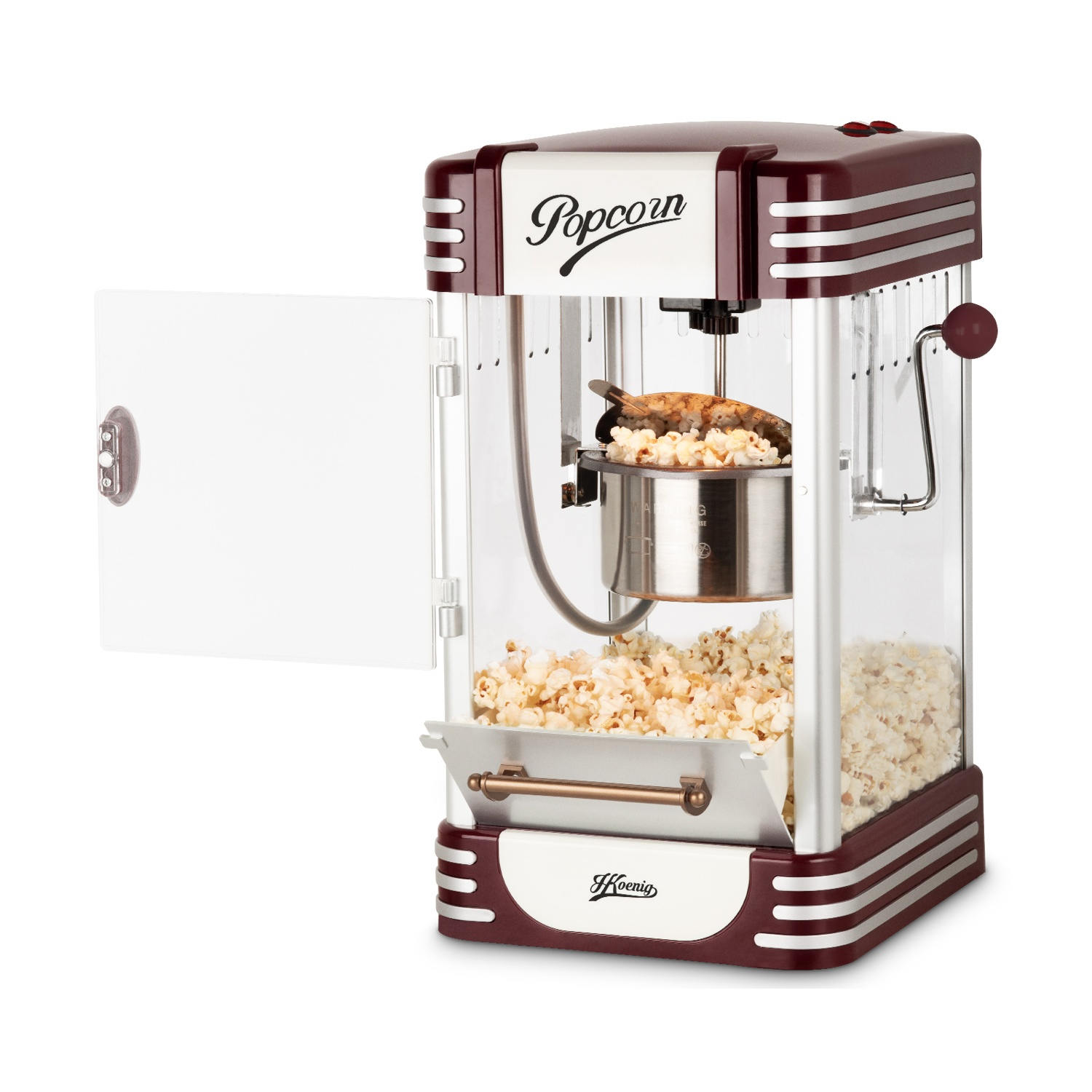 Una macchina per popcorn retrò rossa e bianca con popcorn all'interno e paletta.