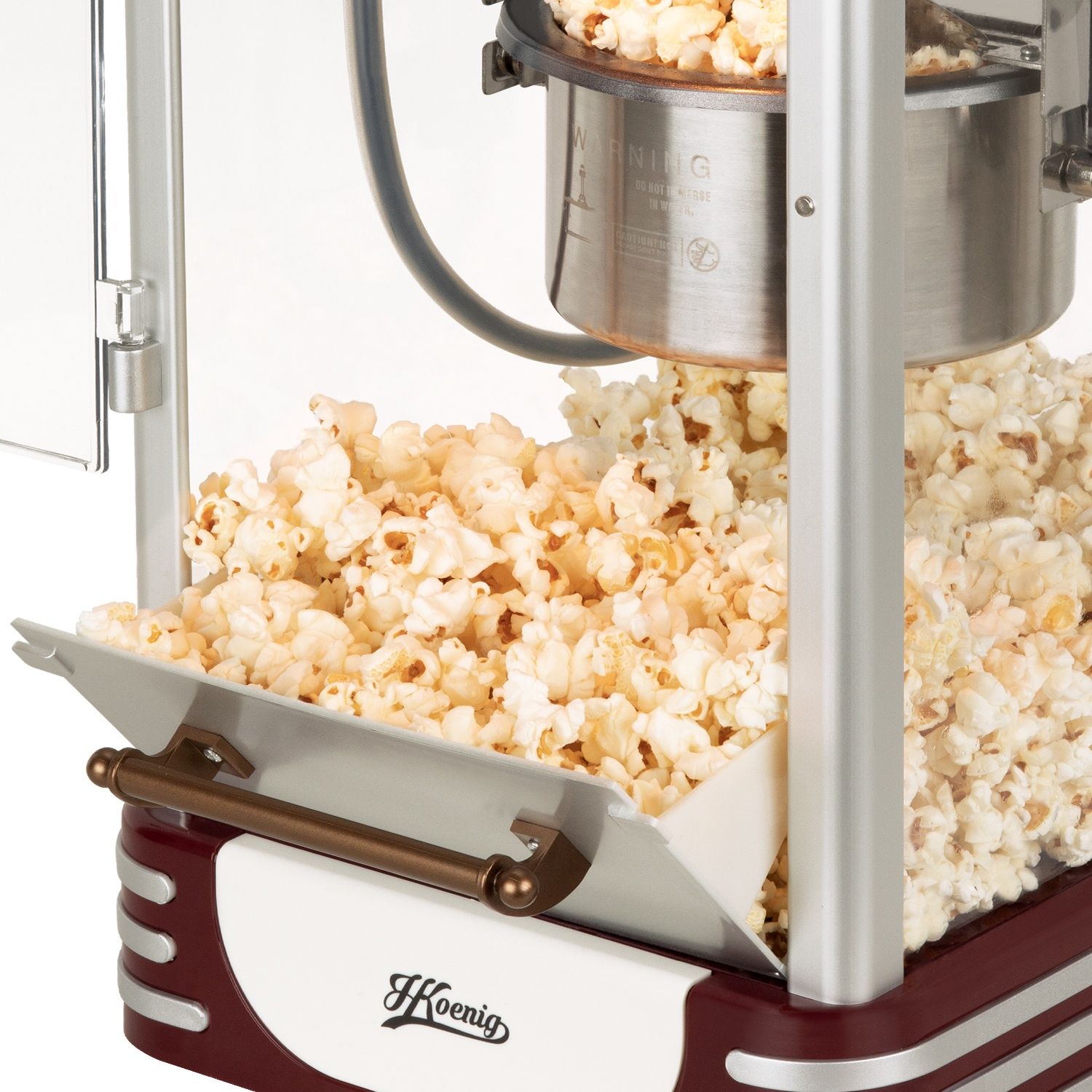 Una macchina per popcorn piena di popcorn appena scoppiati.