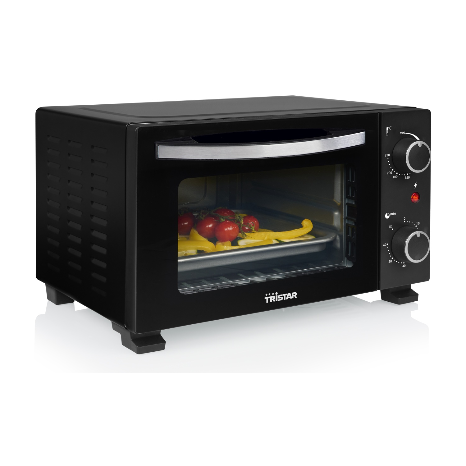 Forno nero da banco con teglia contenente pomodori e peperoni all'interno.