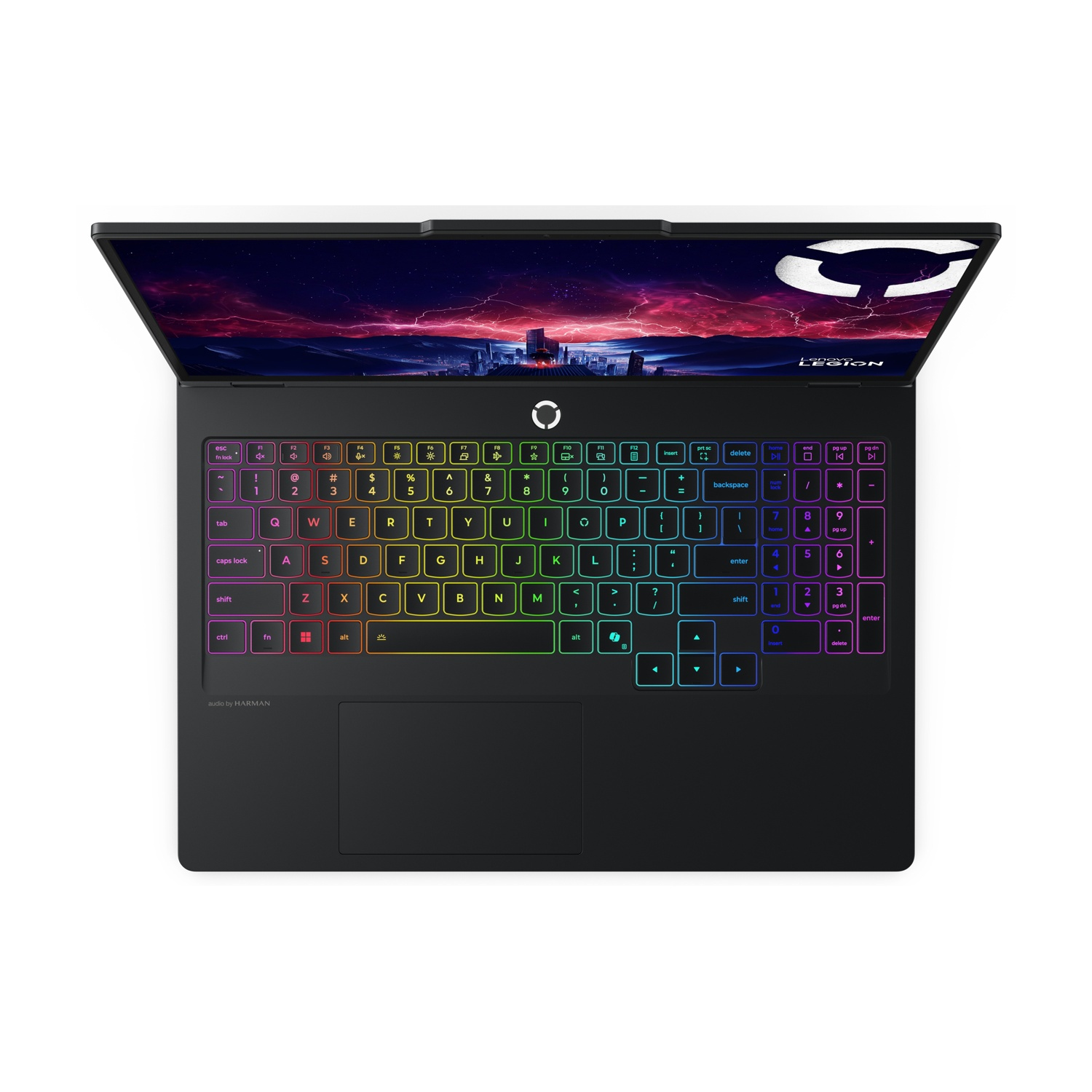 Un laptop nero con tastiera retroilluminata e un paesaggio urbano sullo schermo.