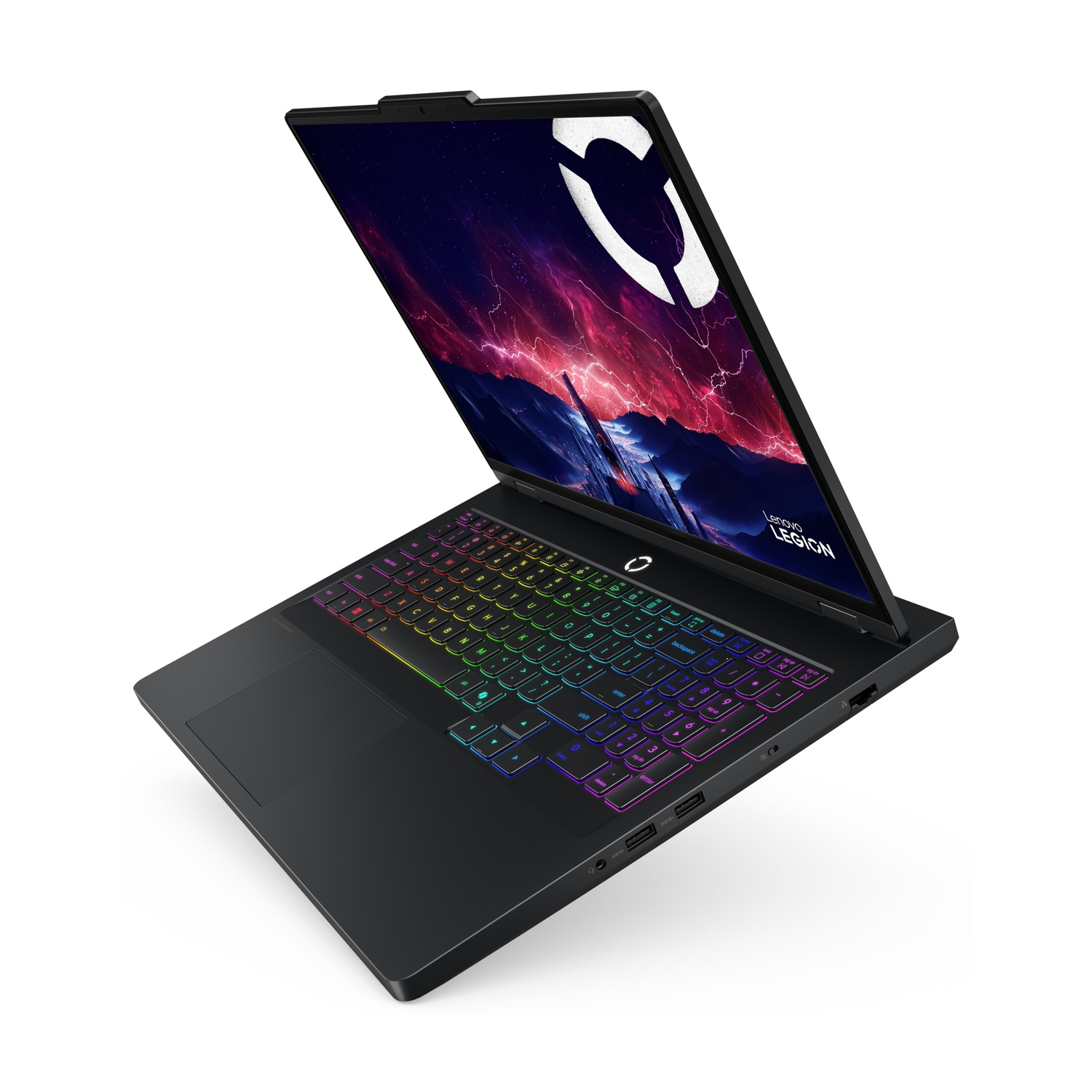 Un laptop nero con tastiera colorata illuminata e sfondo drammatico.