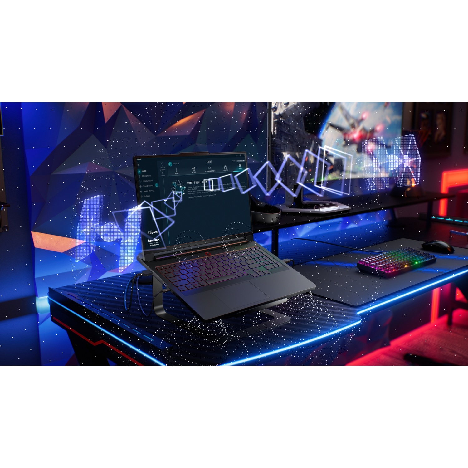 Un laptop da gaming si trova su una scrivania con illuminazione al neon e un monitor esterno.