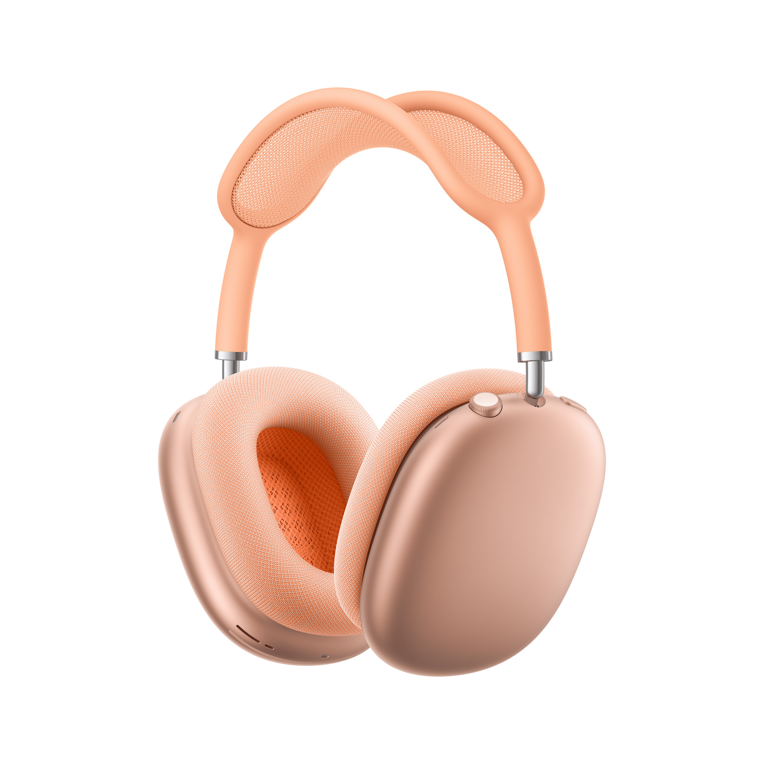 Unos auriculares de color melocotón con almohadillas y diadema.