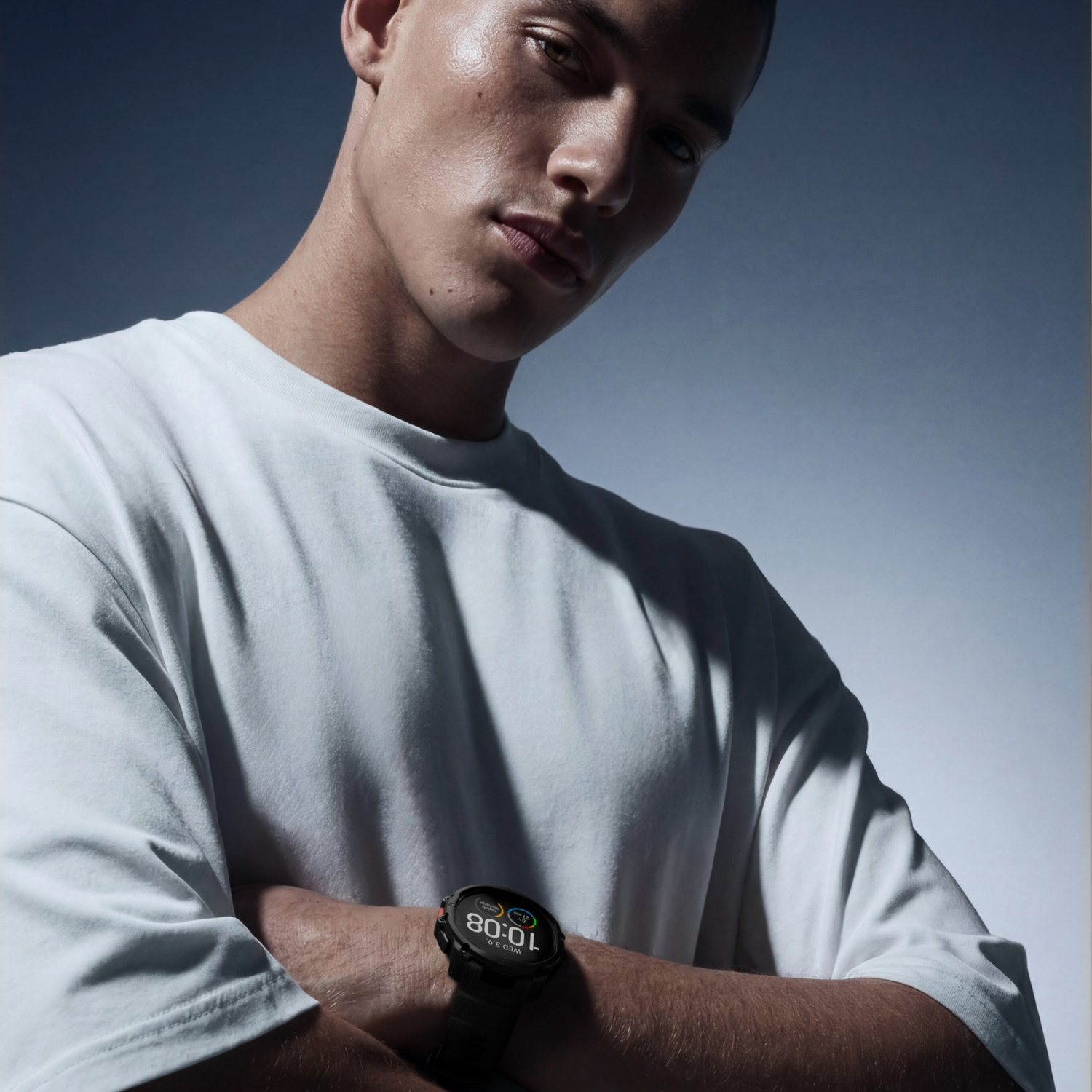 Man in white t-shirt wearing a watch.