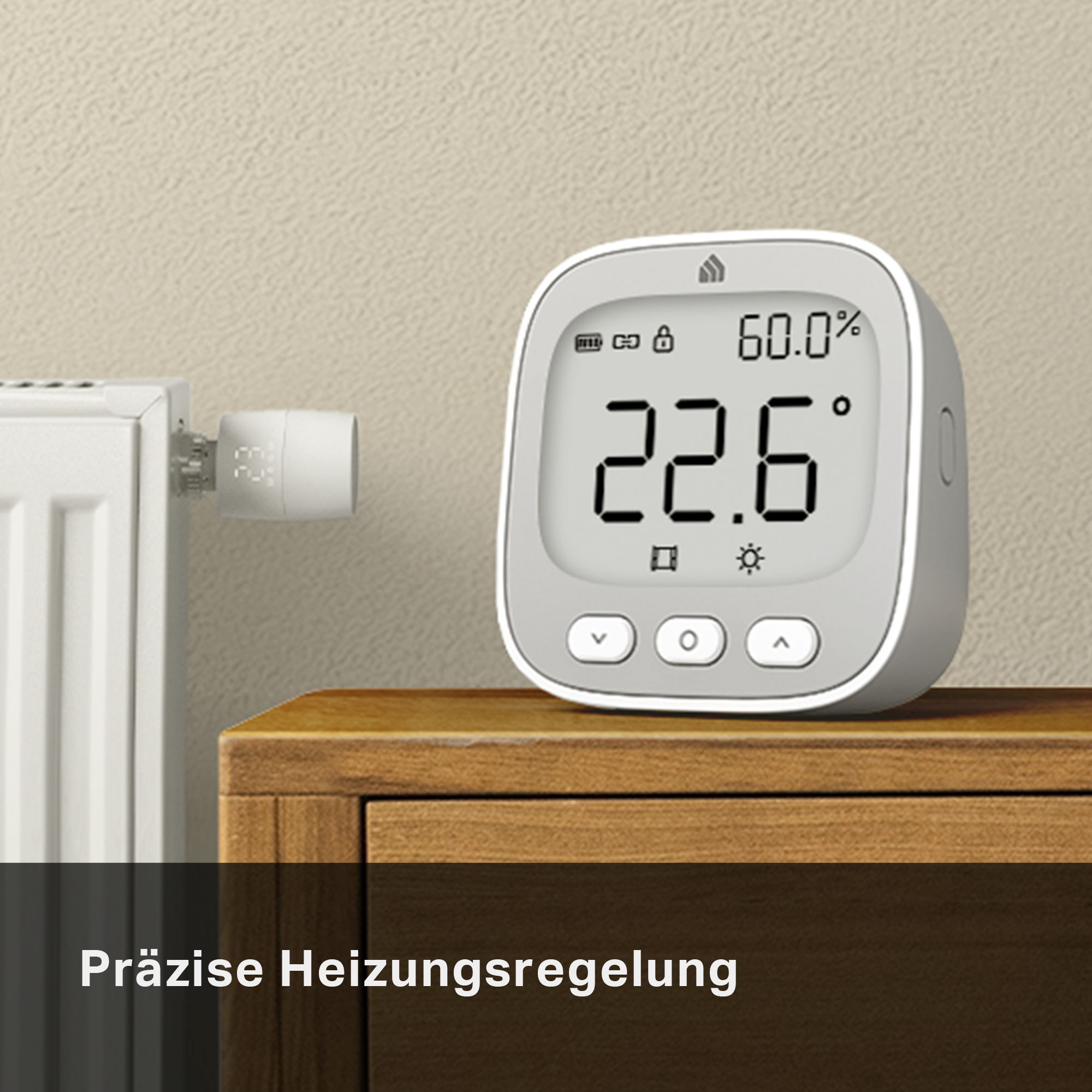 Ein Heizkörperthermostat und ein Digitaldisplay auf einem Holztisch.