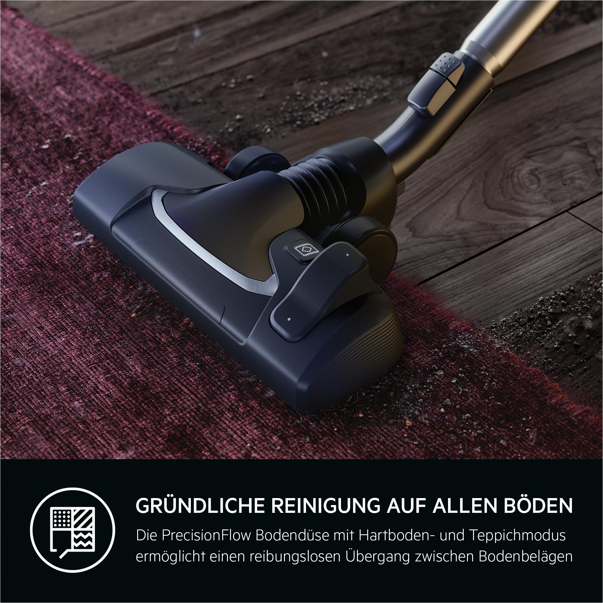 Staubsaugerdüse reinigt Teppich und Holzboden. Nahaufnahme.