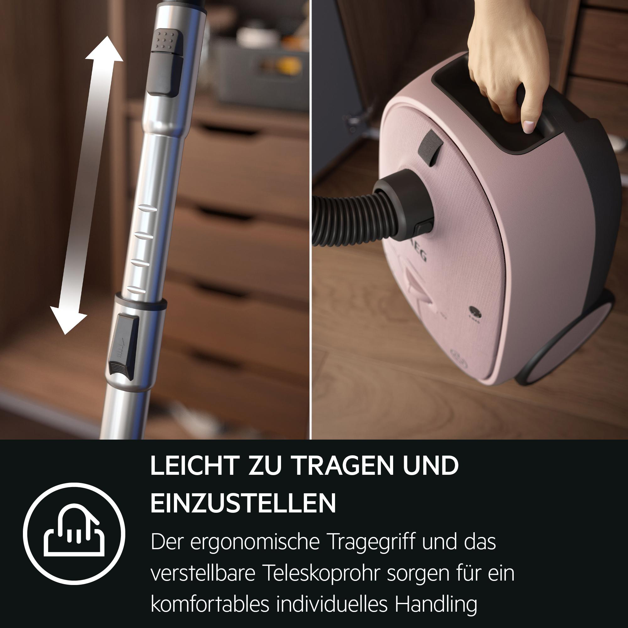 Ein pinker Staubsauger mit Griff und Teleskoprohr. Leicht zu tragen.