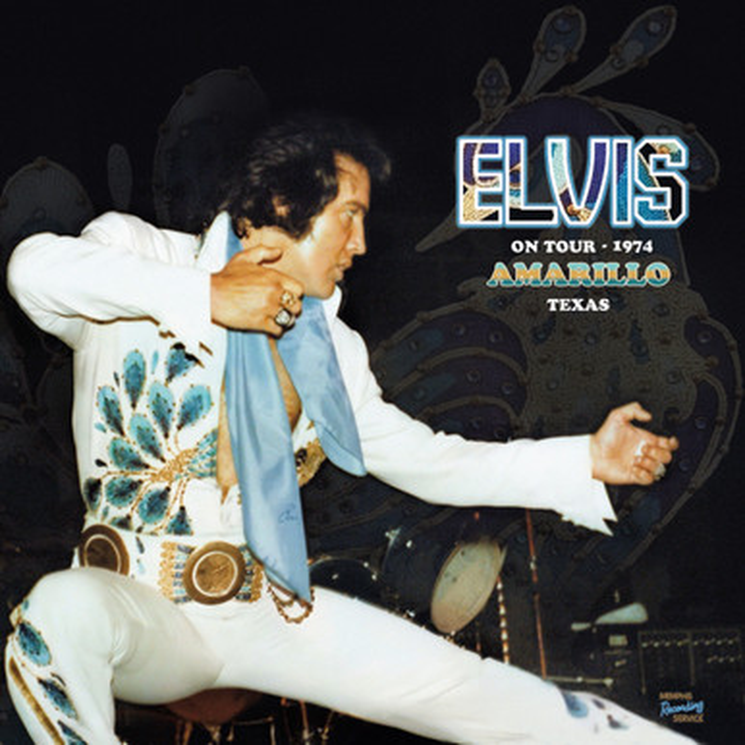 Elvis Presley in a white, blue-embellished suit, performing in Amarillo, Texas, 1974.